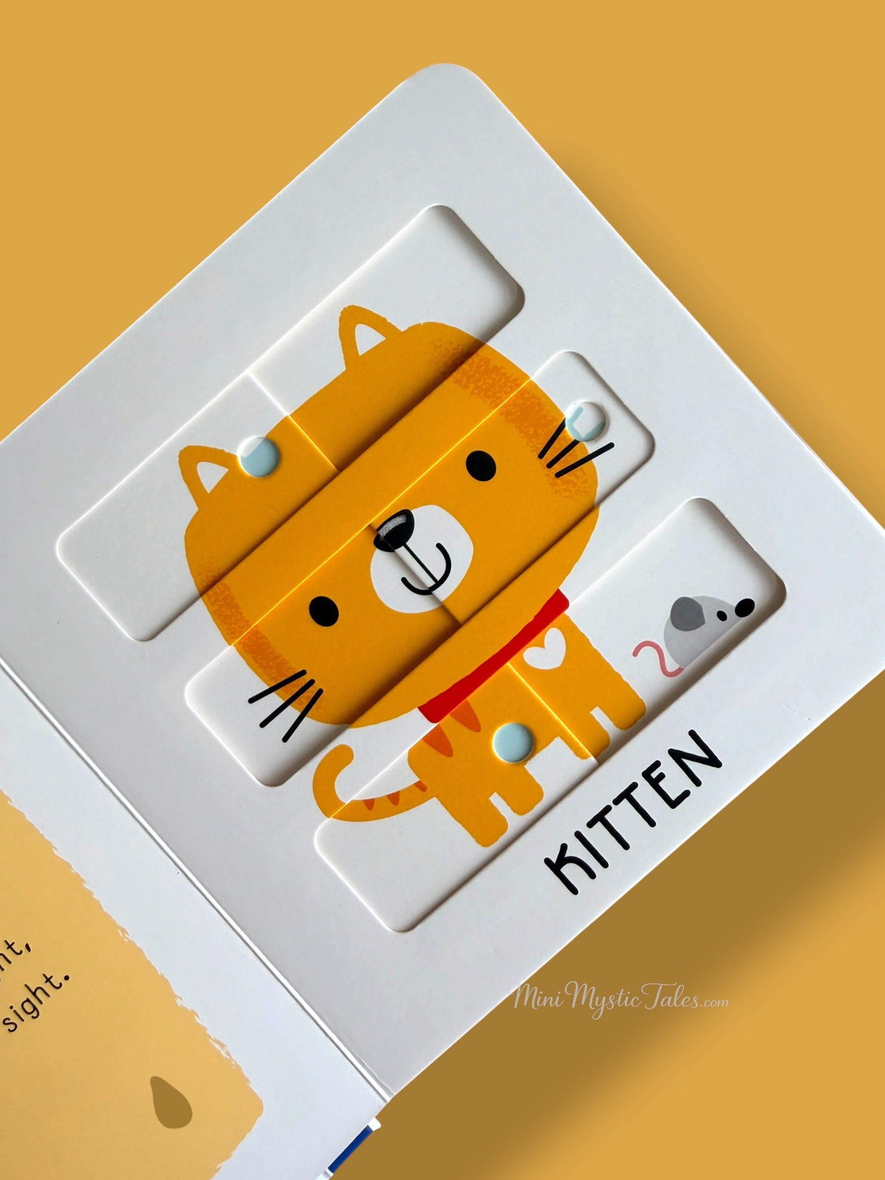 Completed kitten puzzle showing a cute baby cat in an interactive sliding puzzle board book