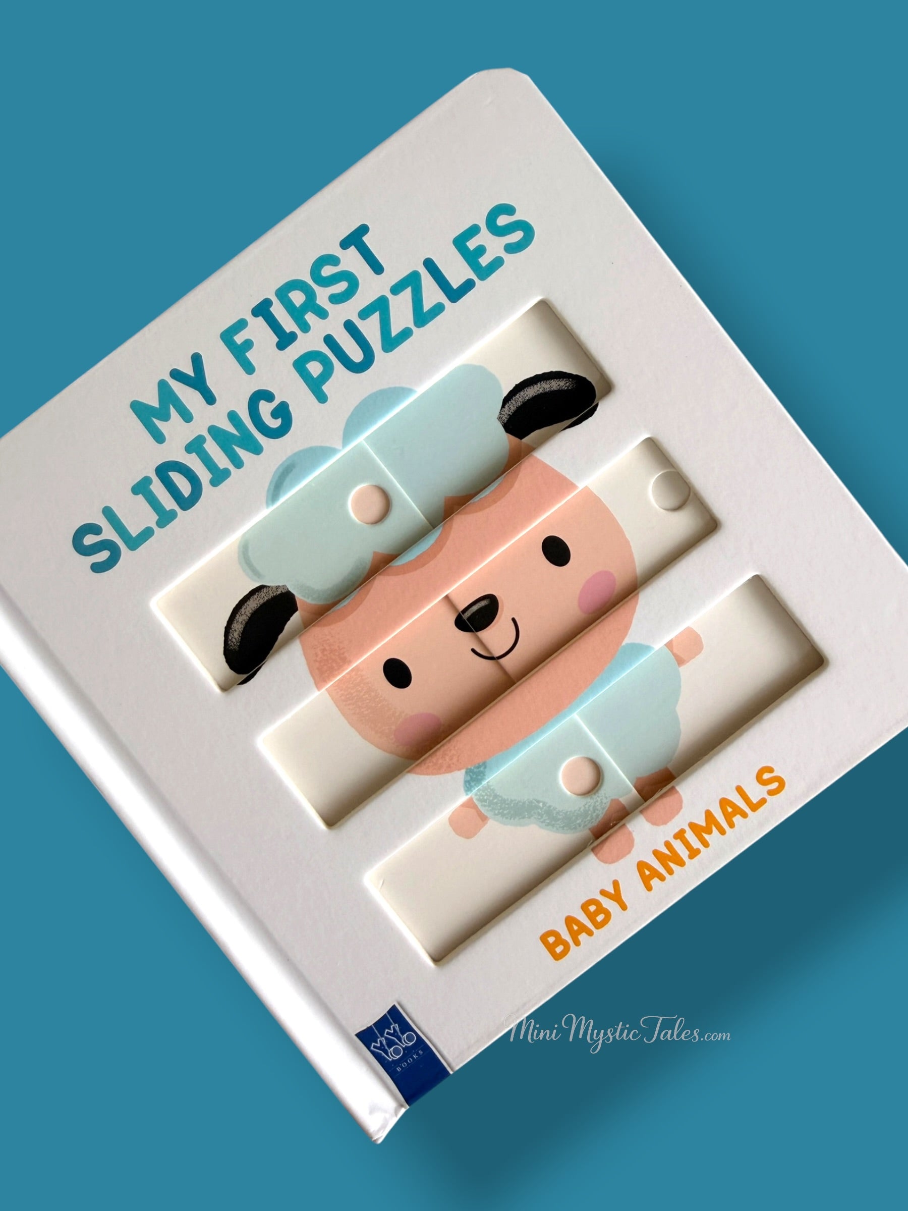 Completed lamb sliding puzzle in an interactive board book for toddlers and preschoolers