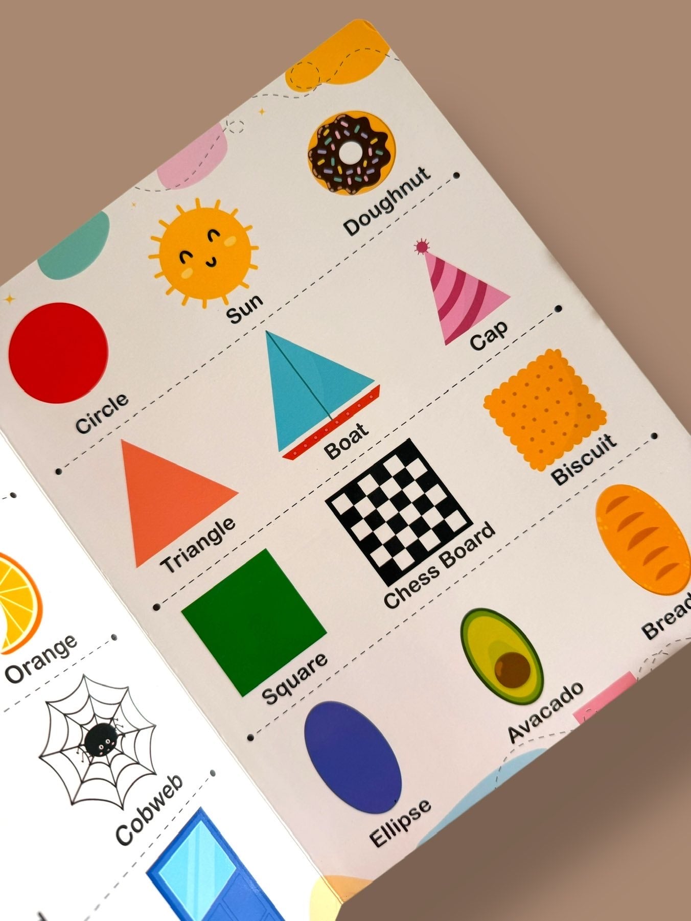 Basic shapes learning page featuring circle, triangle, square, and ellipse with familiar objects like sun, boat, chessboard, doughnut, and biscuit