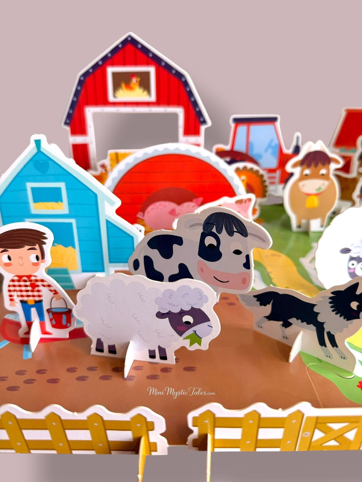 Colourful 3D farm pretend play scene with cow, sheep, farmer, tractor, barn and other farm animals.