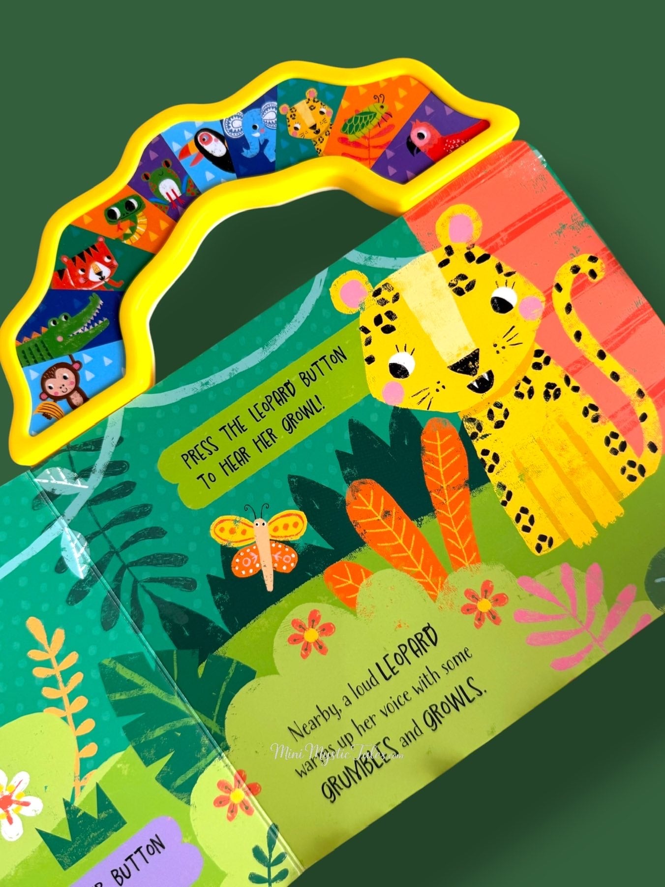 Interactive jungle sound book page featuring a leopard with press-to-play growl sound button for toddlers