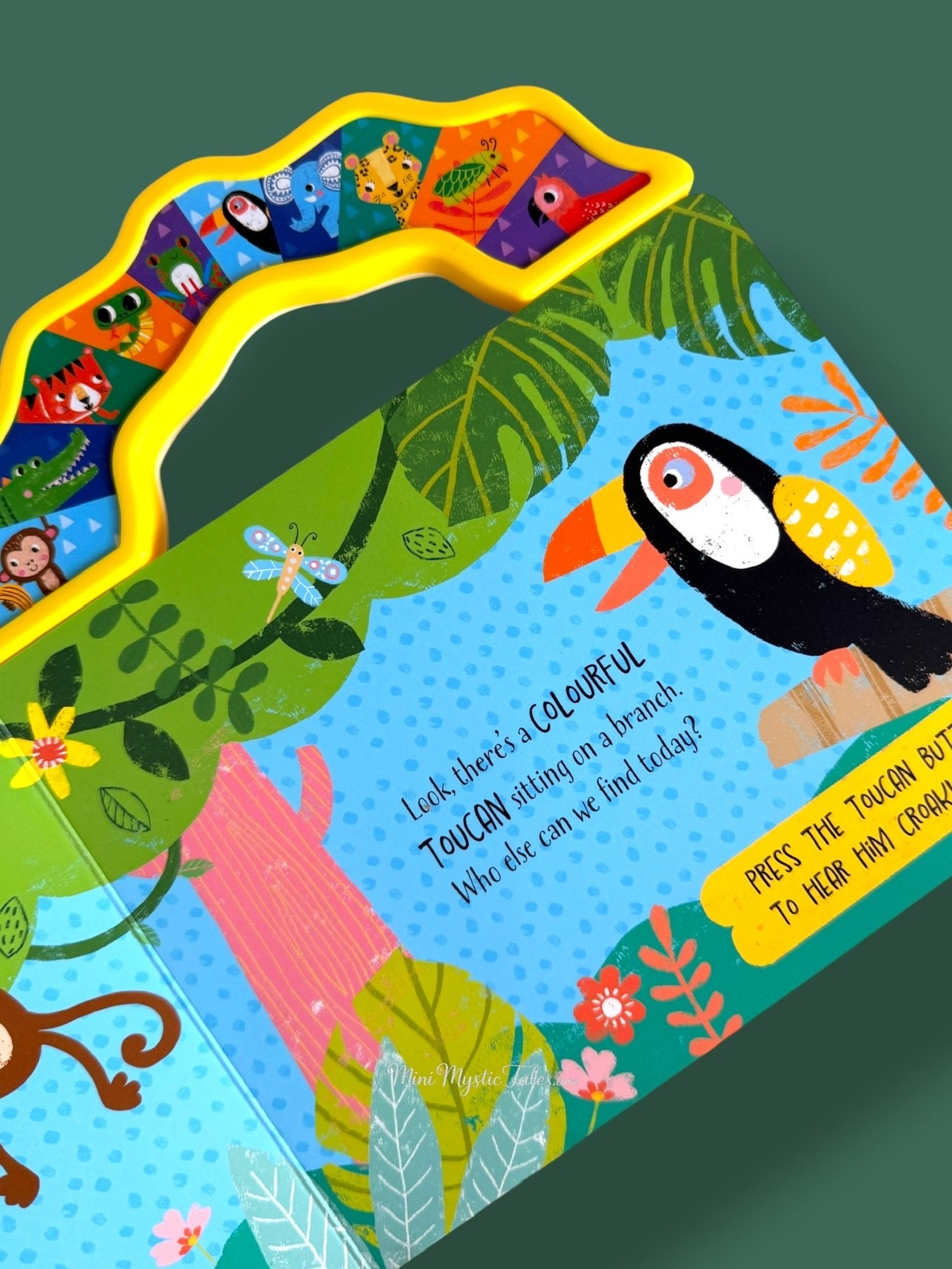 Interactive jungle sound book page featuring a colourful toucan with press-to-play sound button