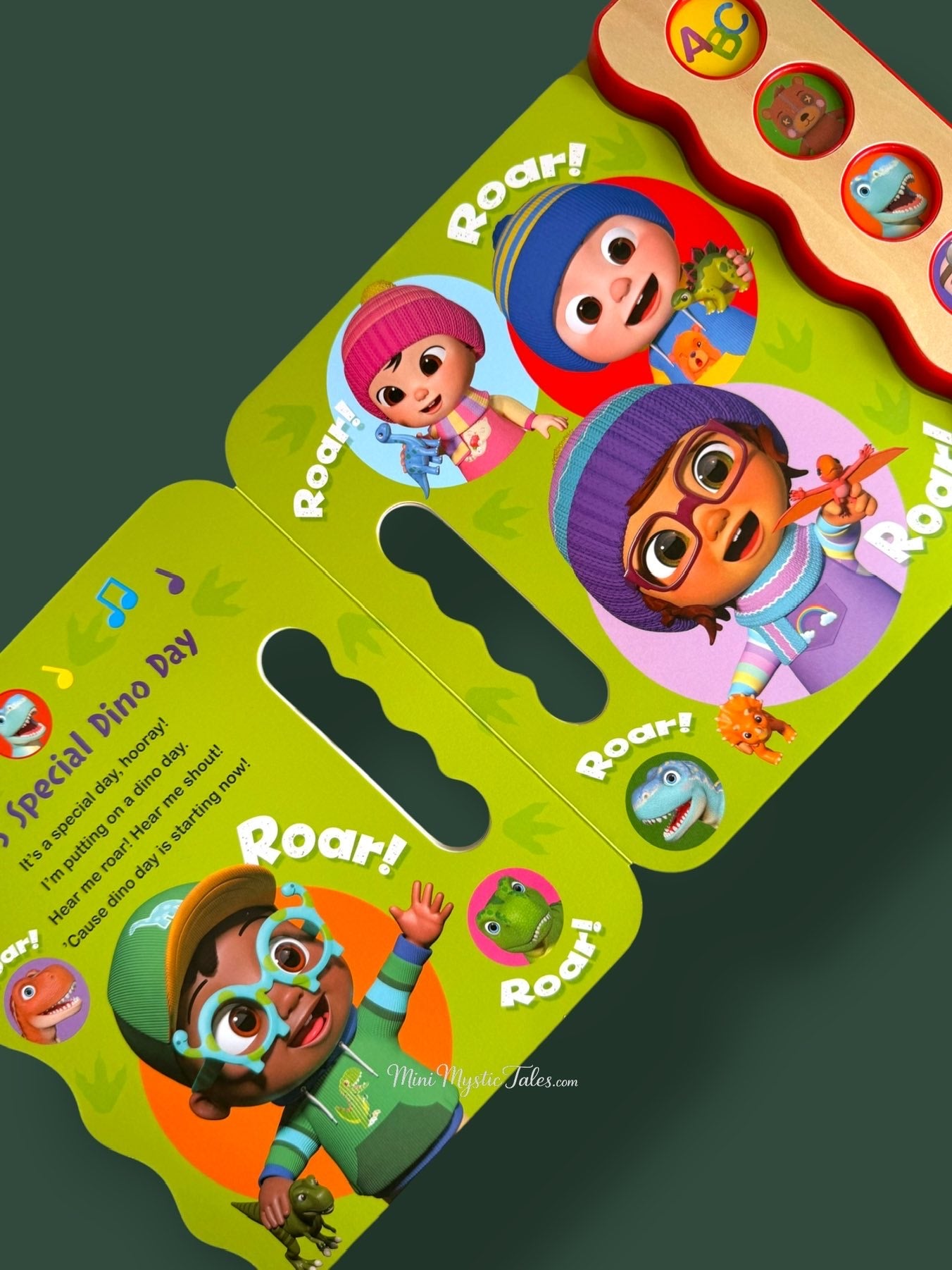 CoComelon kids sound book featuring Special Dino Day song with interactive sound buttons and dinosaur illustrations