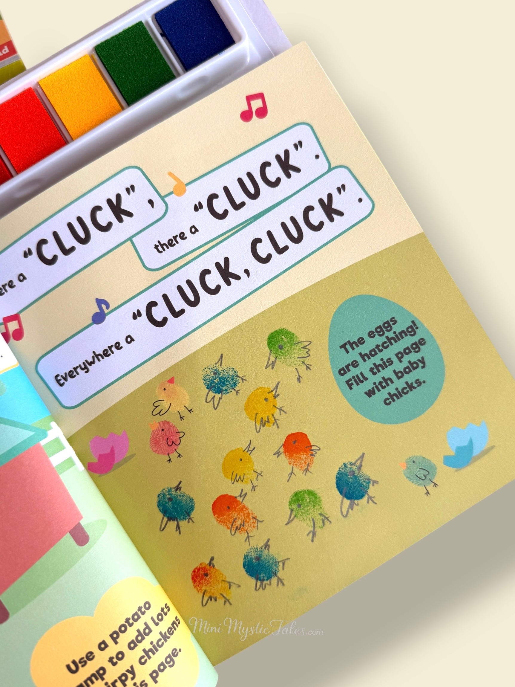 Completed Cocomelon fingerprint baby chicks activity page with colourful chicks