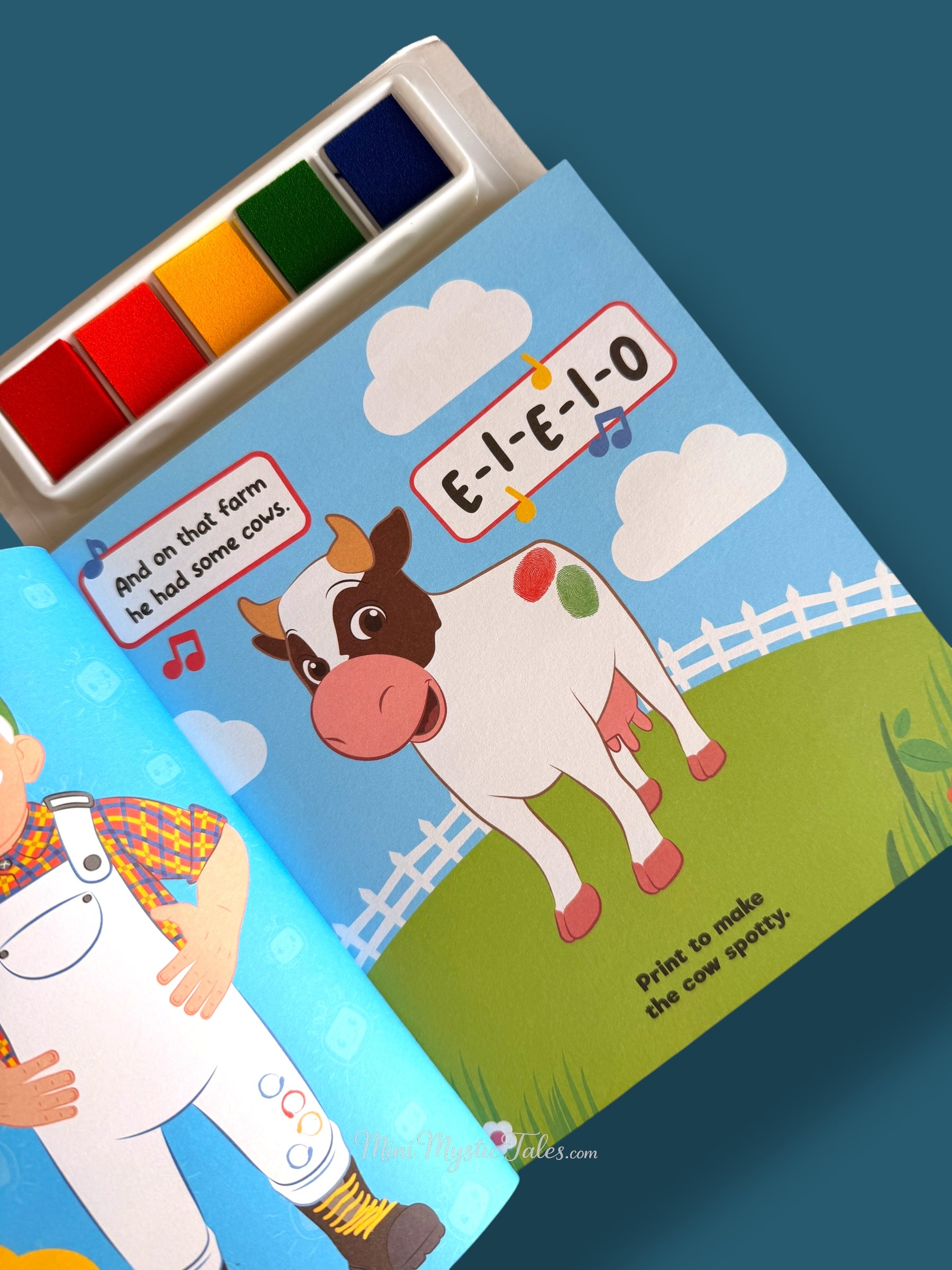 Cocomelon fingerprint activity page where kids make colourful spots on the cow
