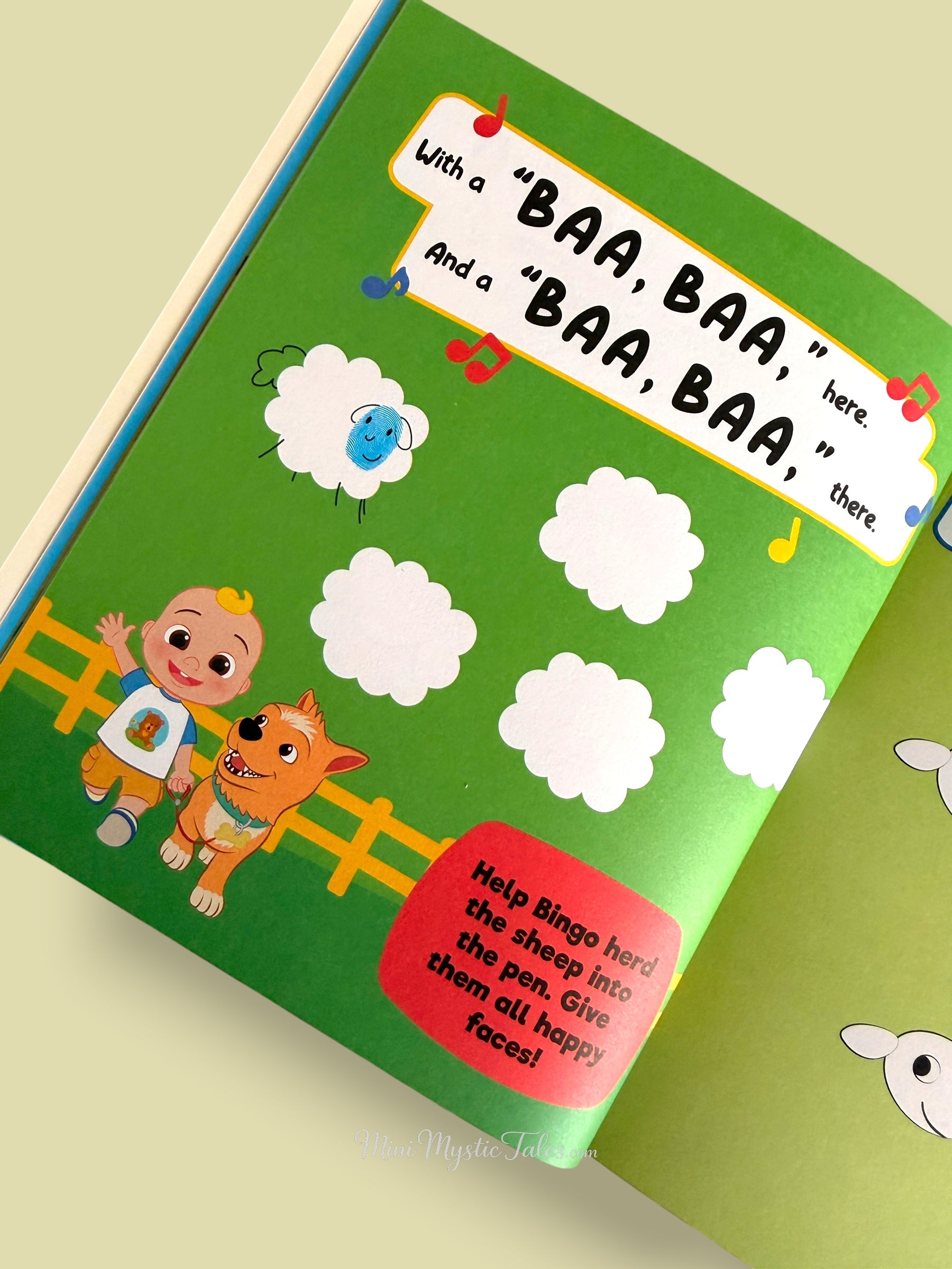 Cocomelon fingerprint sheep activity page where kids create happy sheep faces