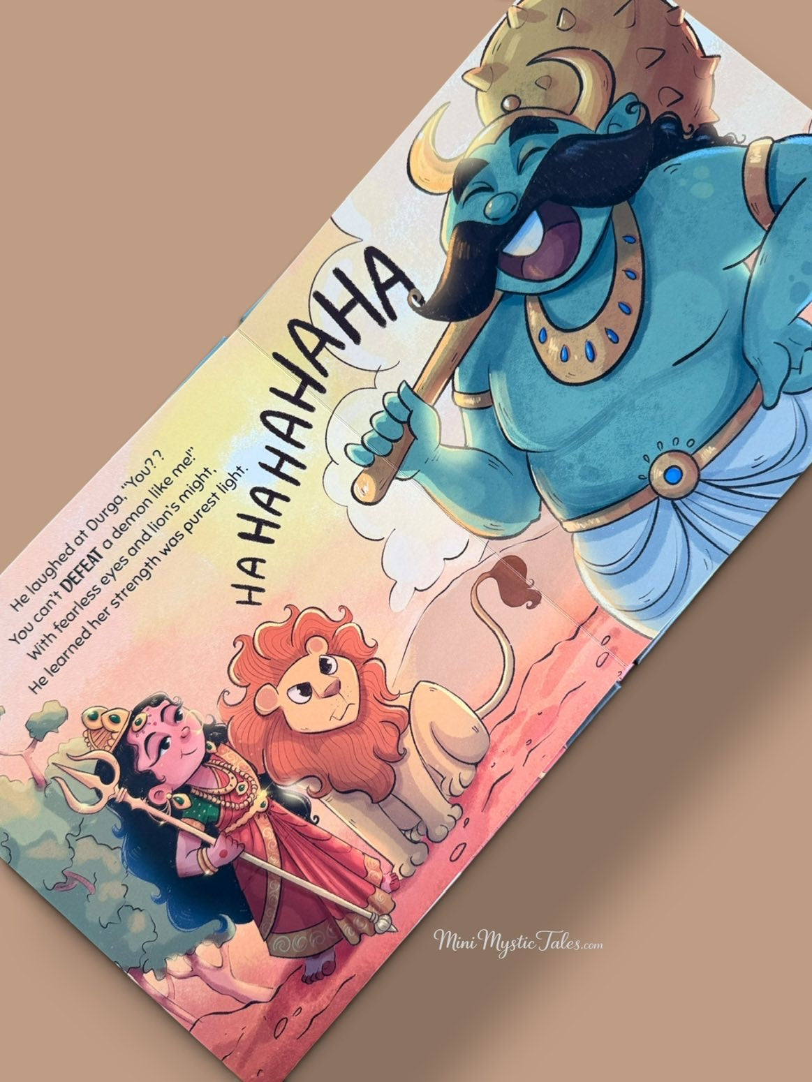 Illustrated story scene of brave Durga Ma facing the demon in Durga Ma The Lion Queen, an Indian mythology book for children.