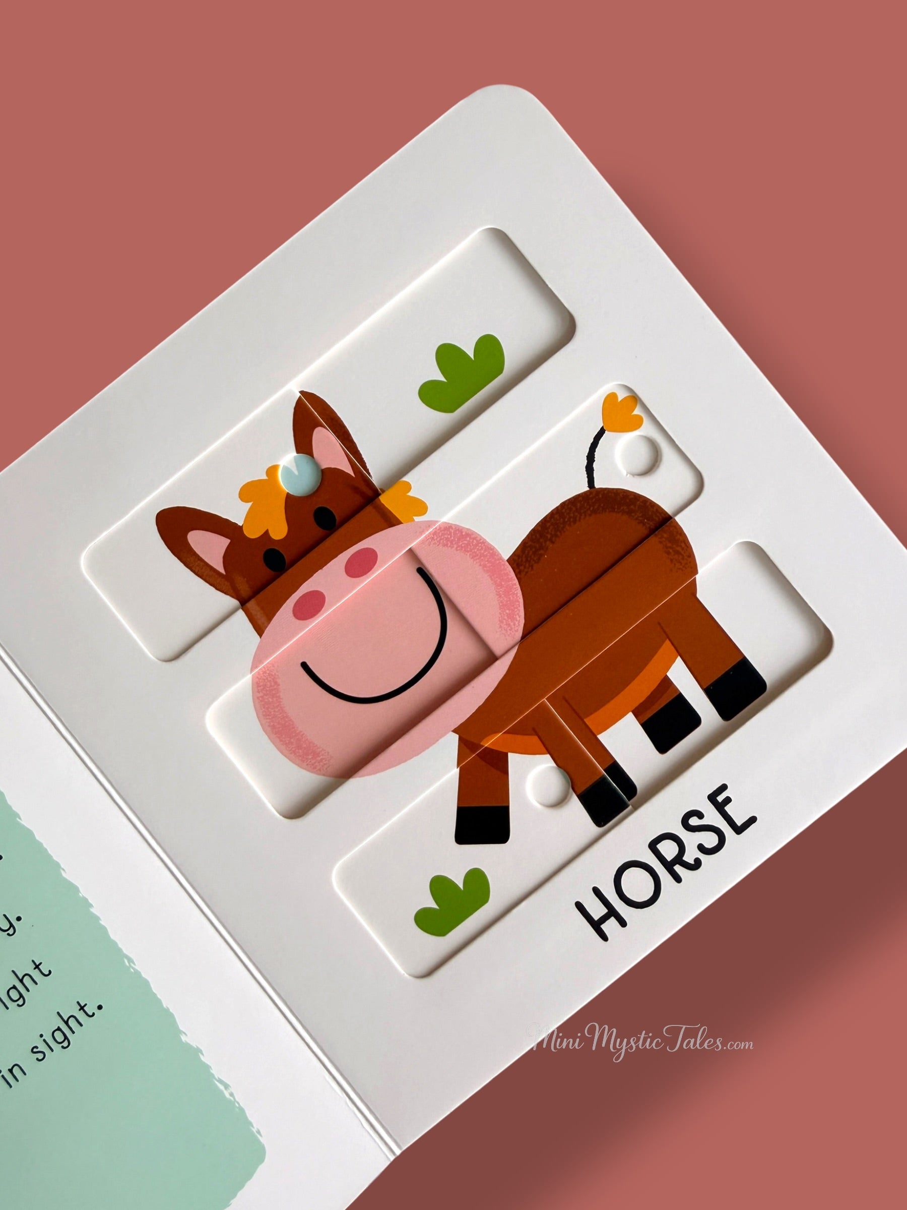 Completed horse sliding puzzle showing the finished farm animal image in a toddler activity book