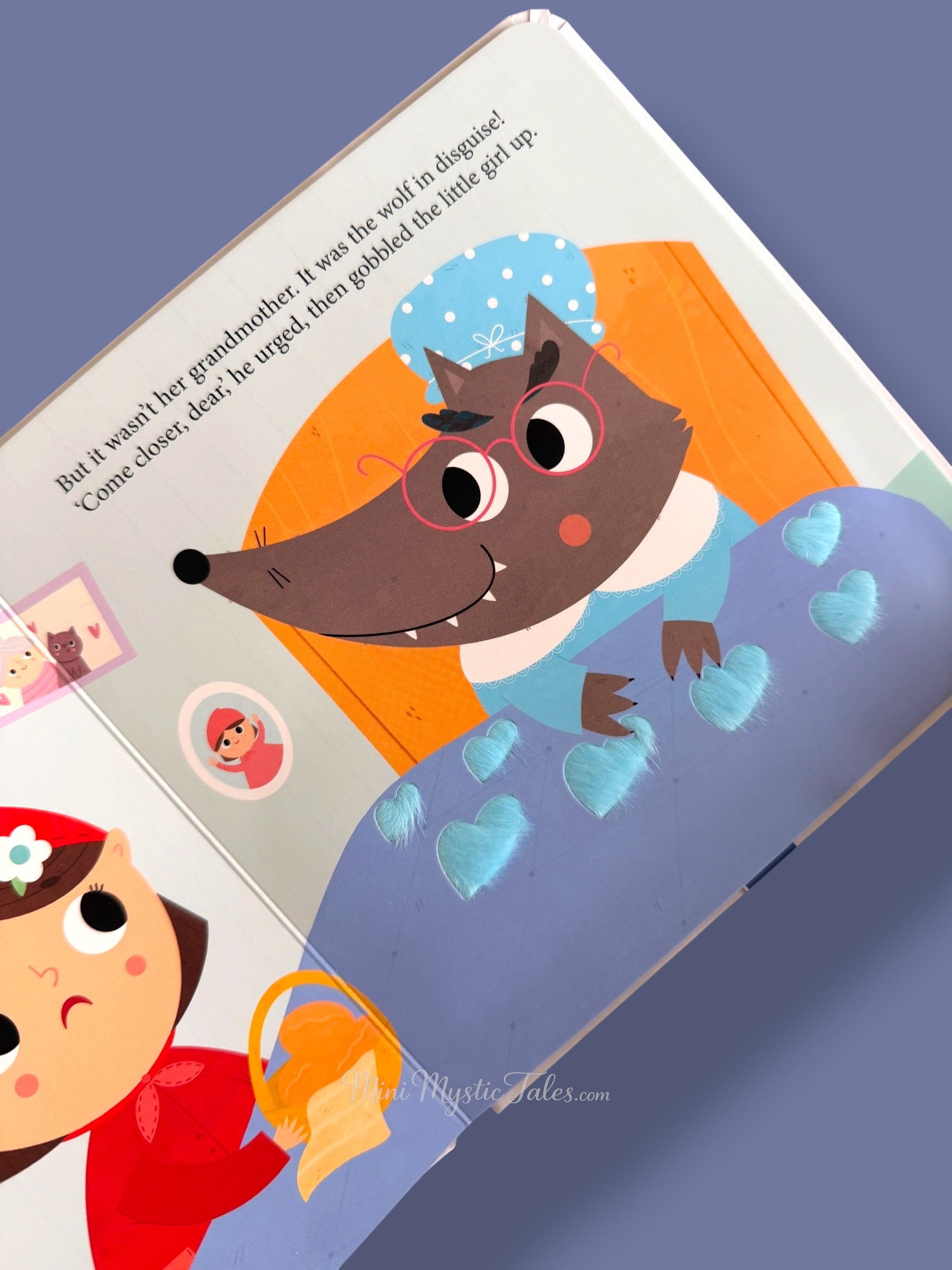 Little Red Riding Hood story page with wolf disguised as grandmother in touch and feel book
