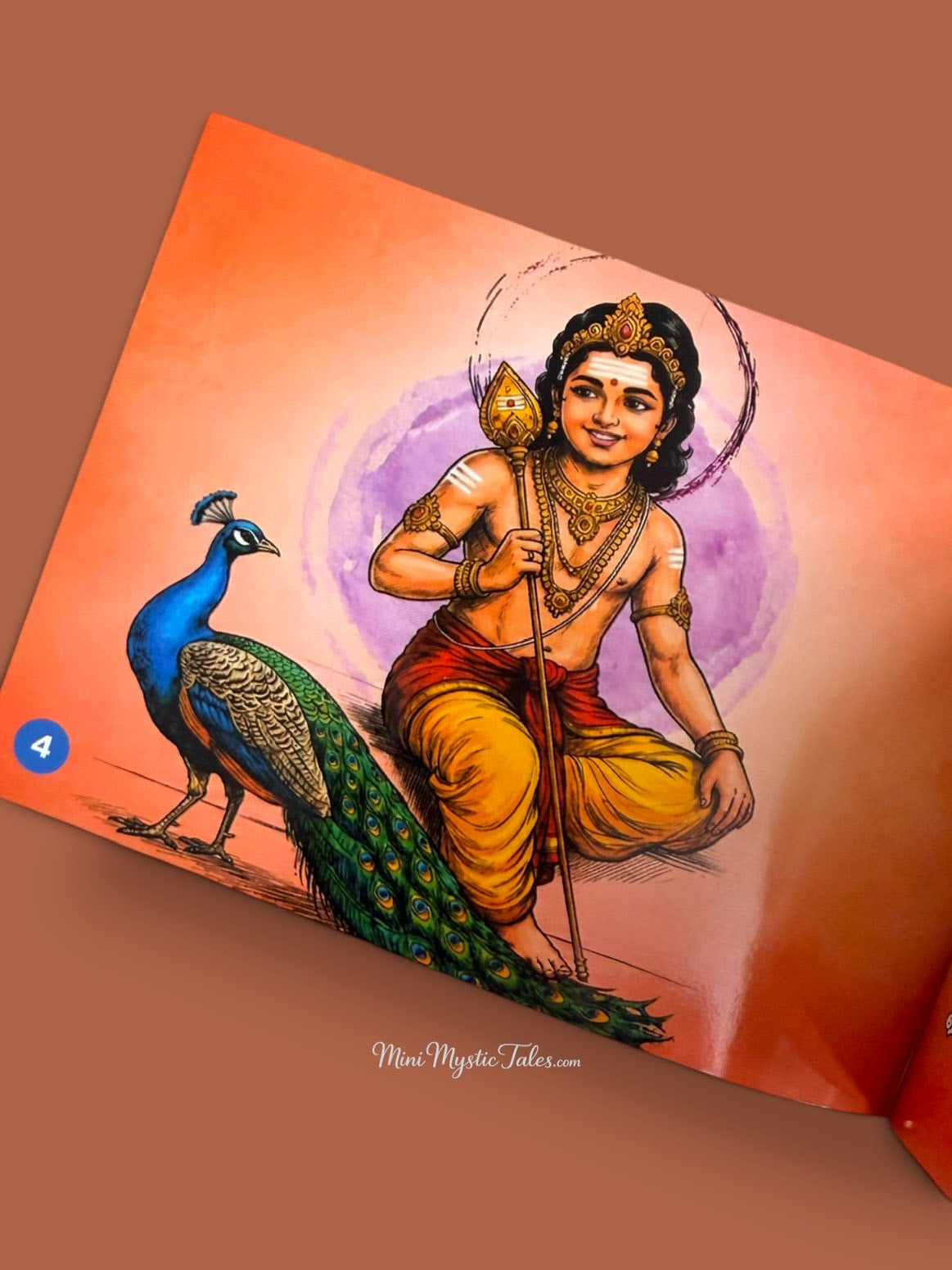 Lord Murugan with Vel and peacock illustration inside the Shanmuga Kavasam Tamil devotional book.
