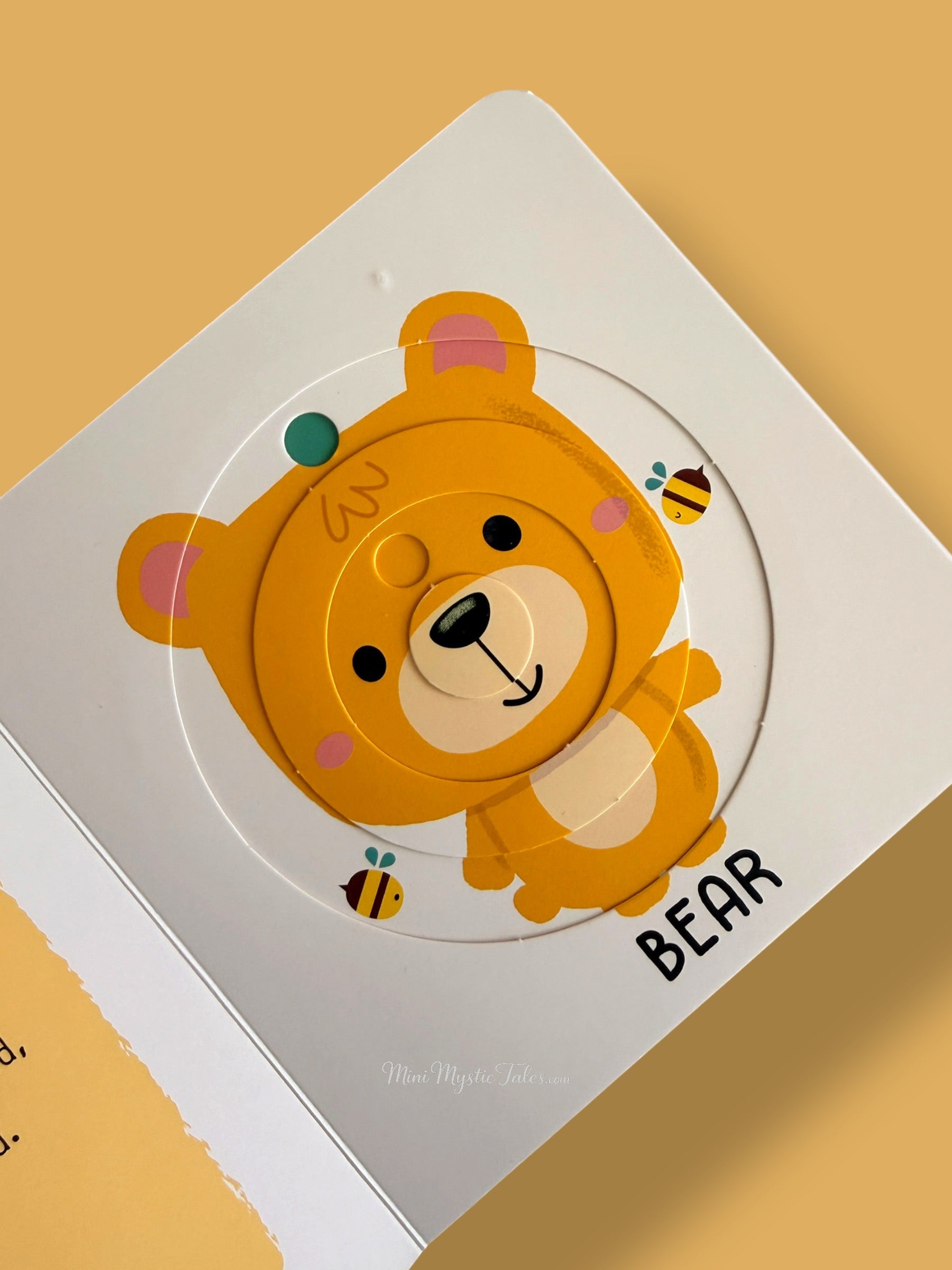Completed bear rotating puzzle in My First Sliding Puzzles Countryside Animals interactive board book for toddlers
