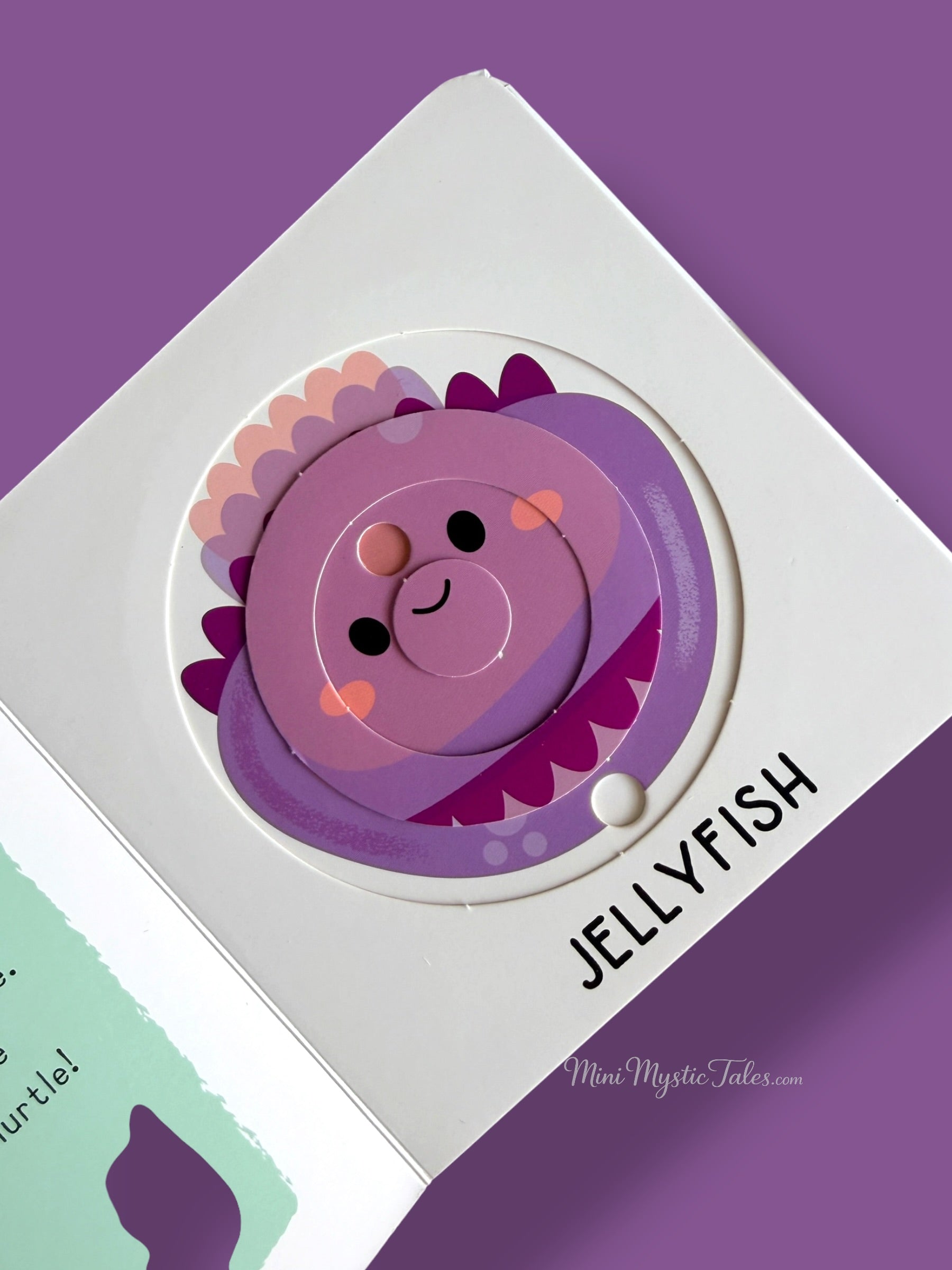 Completed jellyfish puzzle in an interactive board book designed to improve hand-eye coordination and fine motor skills
