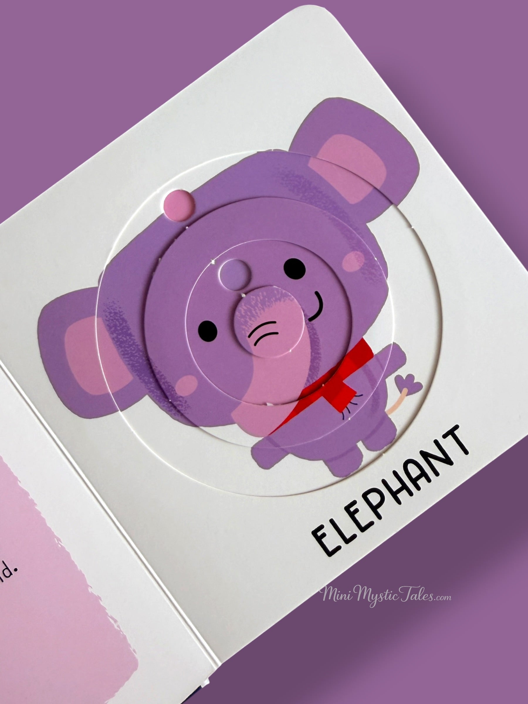 Completed elephant puzzle in an interactive board book designed to build concentration and fine motor skills