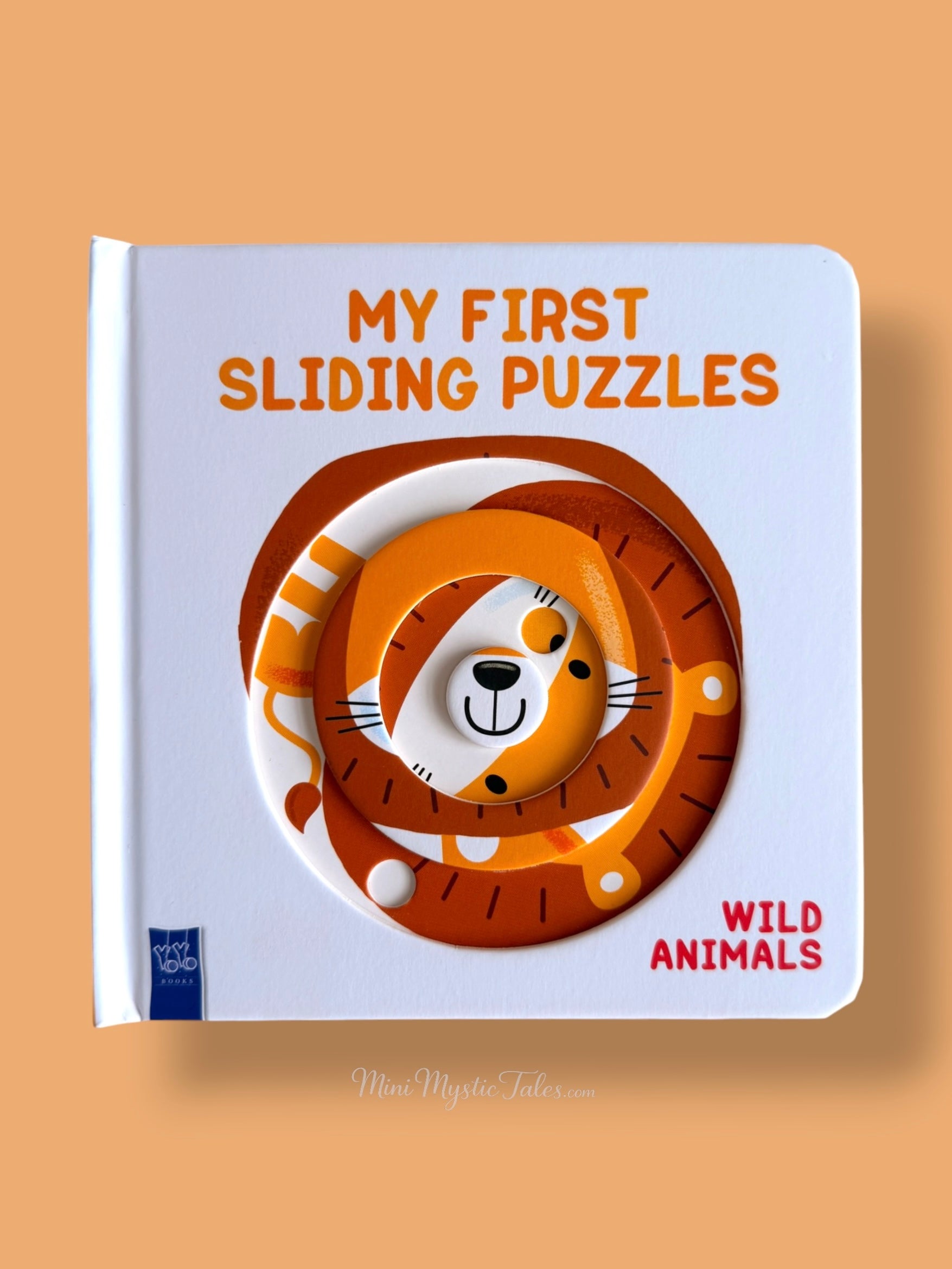 Interactive lion-themed rotating puzzle on a toddler board book that helps develop fine motor skills and problem-solving abilities