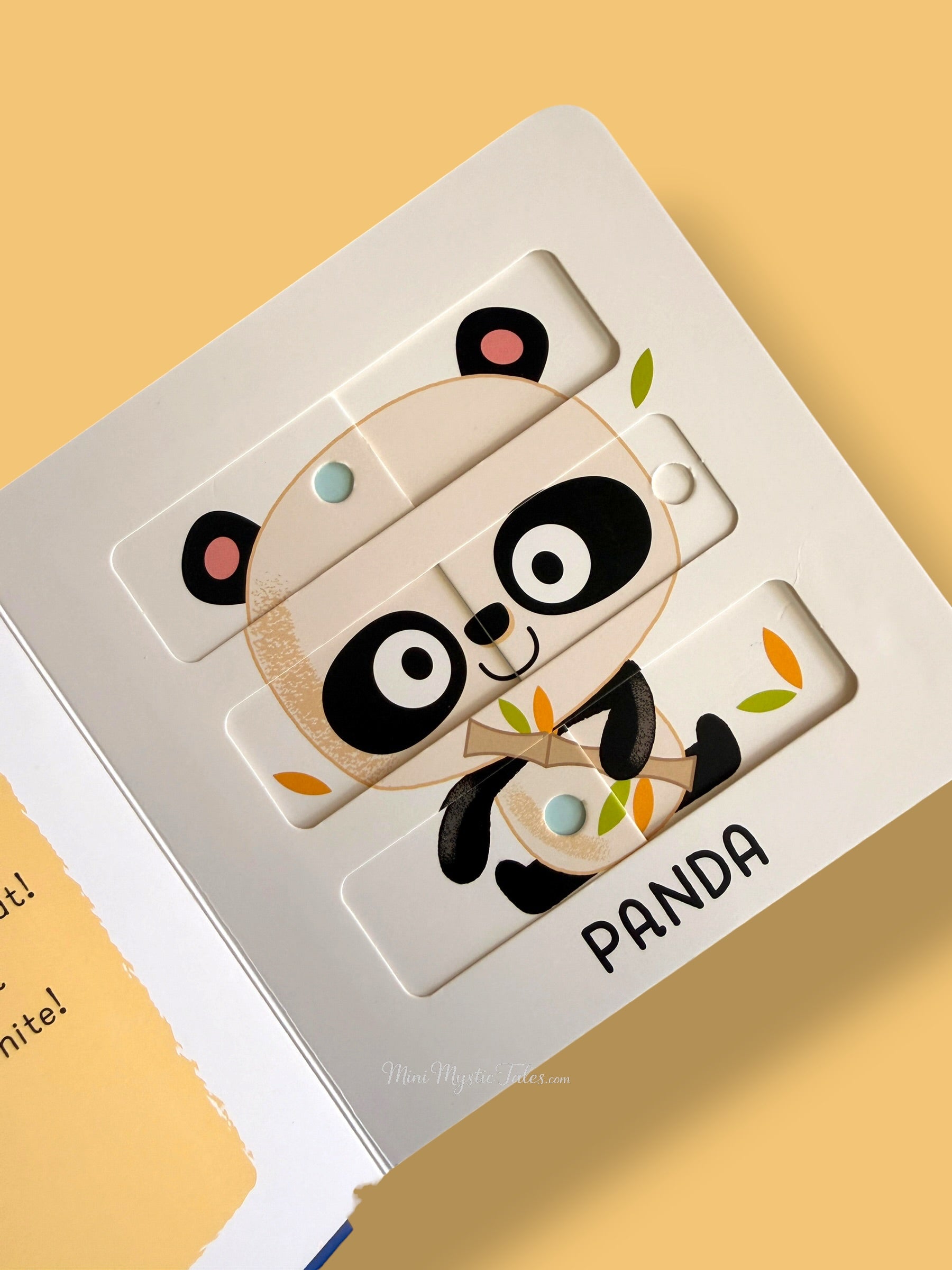 Completed panda sliding puzzle in My First Sliding Puzzles Zoo Animals interactive board book for preschool children