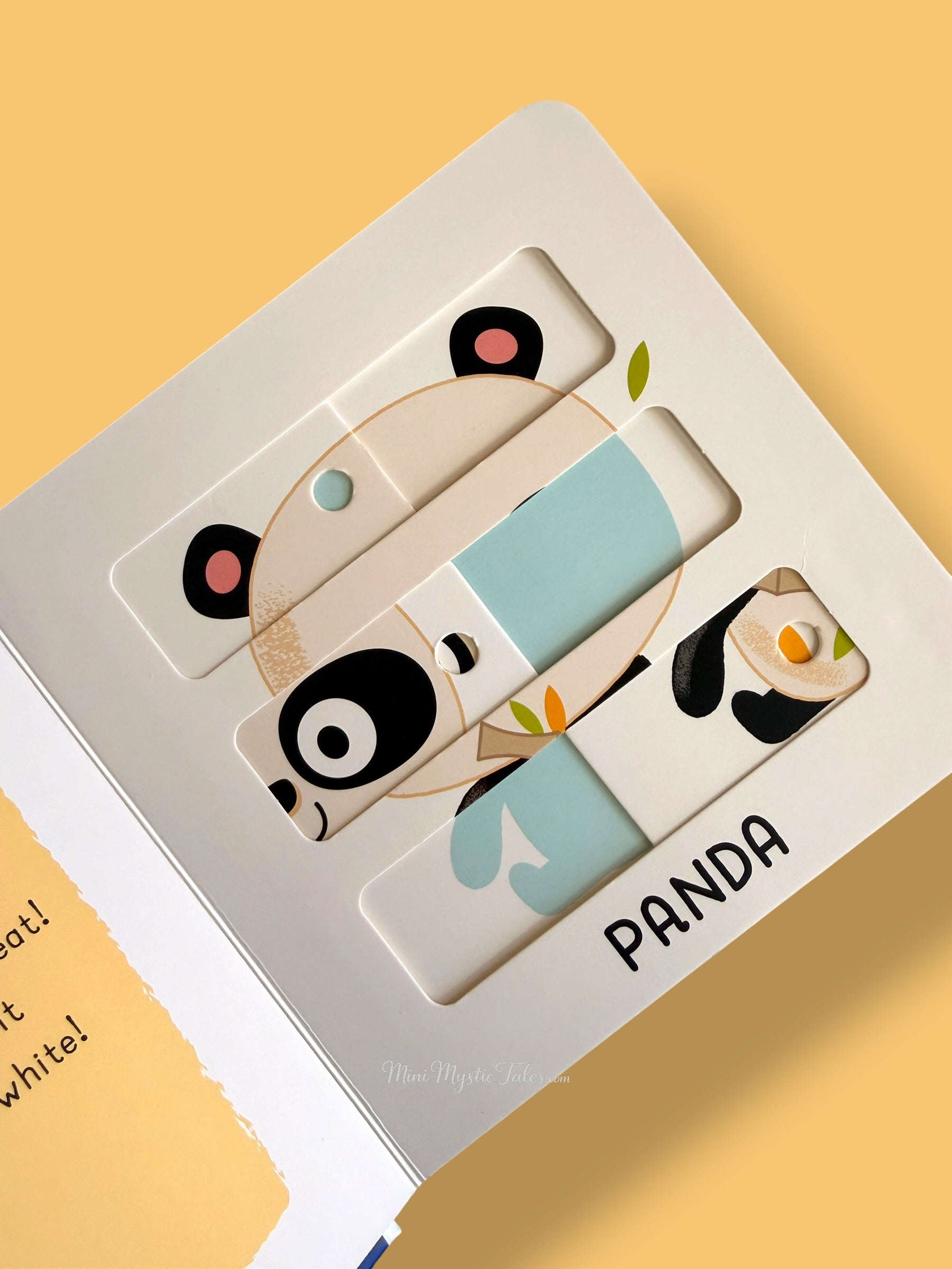 Interactive sliding panda puzzle page from My First Sliding Puzzles Zoo Animals board book for toddlers developing fine motor skills