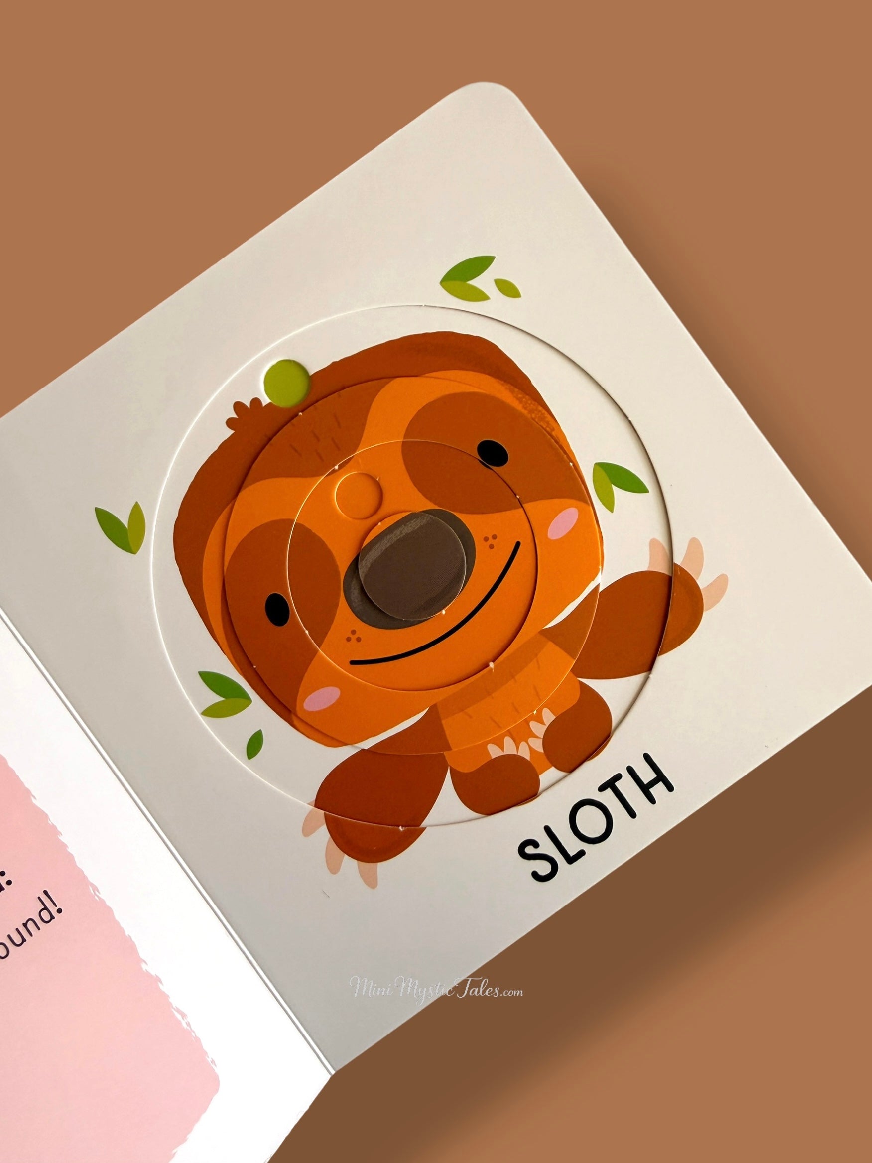 Completed sloth rotating puzzle in My First Sliding Puzzles Zoo Animals educational board book for toddlers