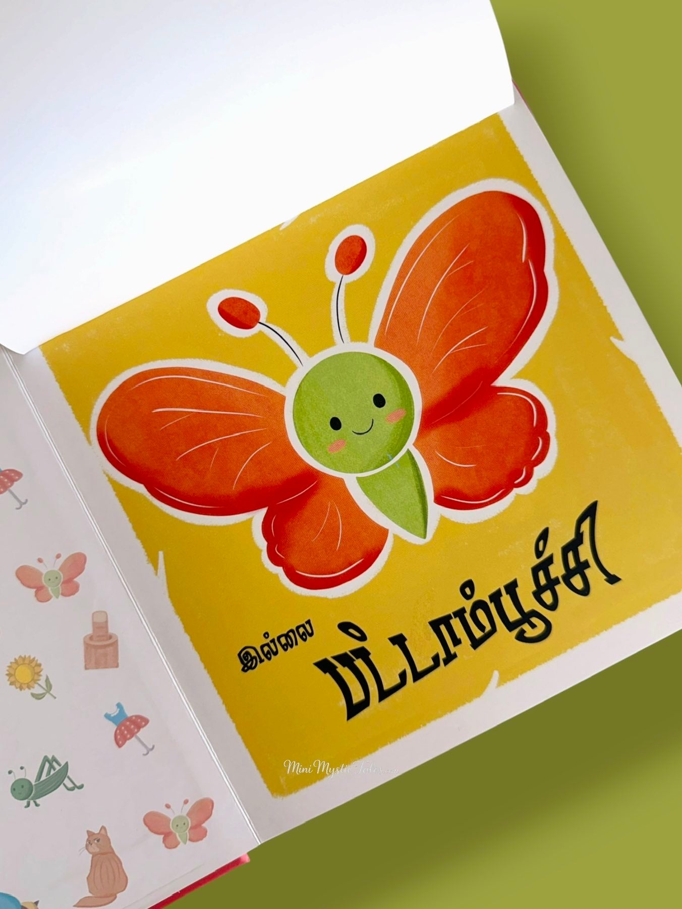 Tamil Guess and Flap book revealing a colourful butterfly after lifting the flap for interactive learning