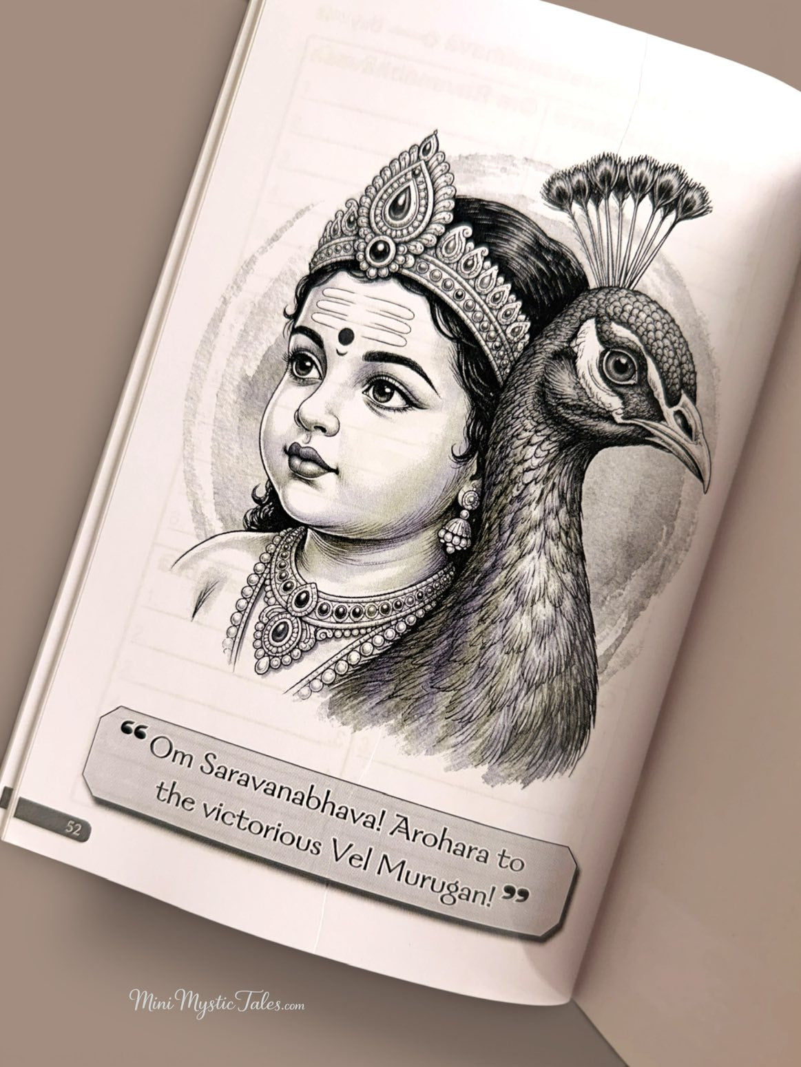 Detailed black-and-white illustration of baby Lord Murugan beside a peacock inside the Om Saravana Bhava 36 English devotional writing book.