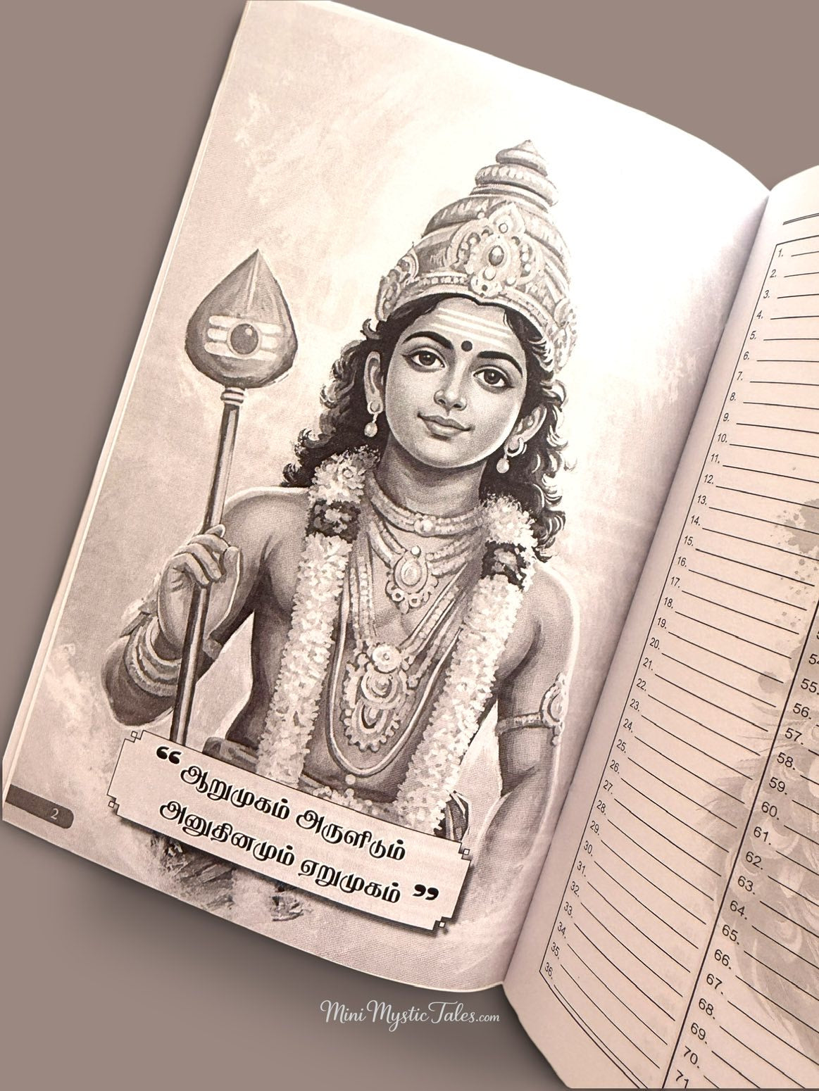 Lord Murugan holding the sacred Vel with a traditional crown and garland inside the Om Saravana Bhava 21-day mantra writing book.
