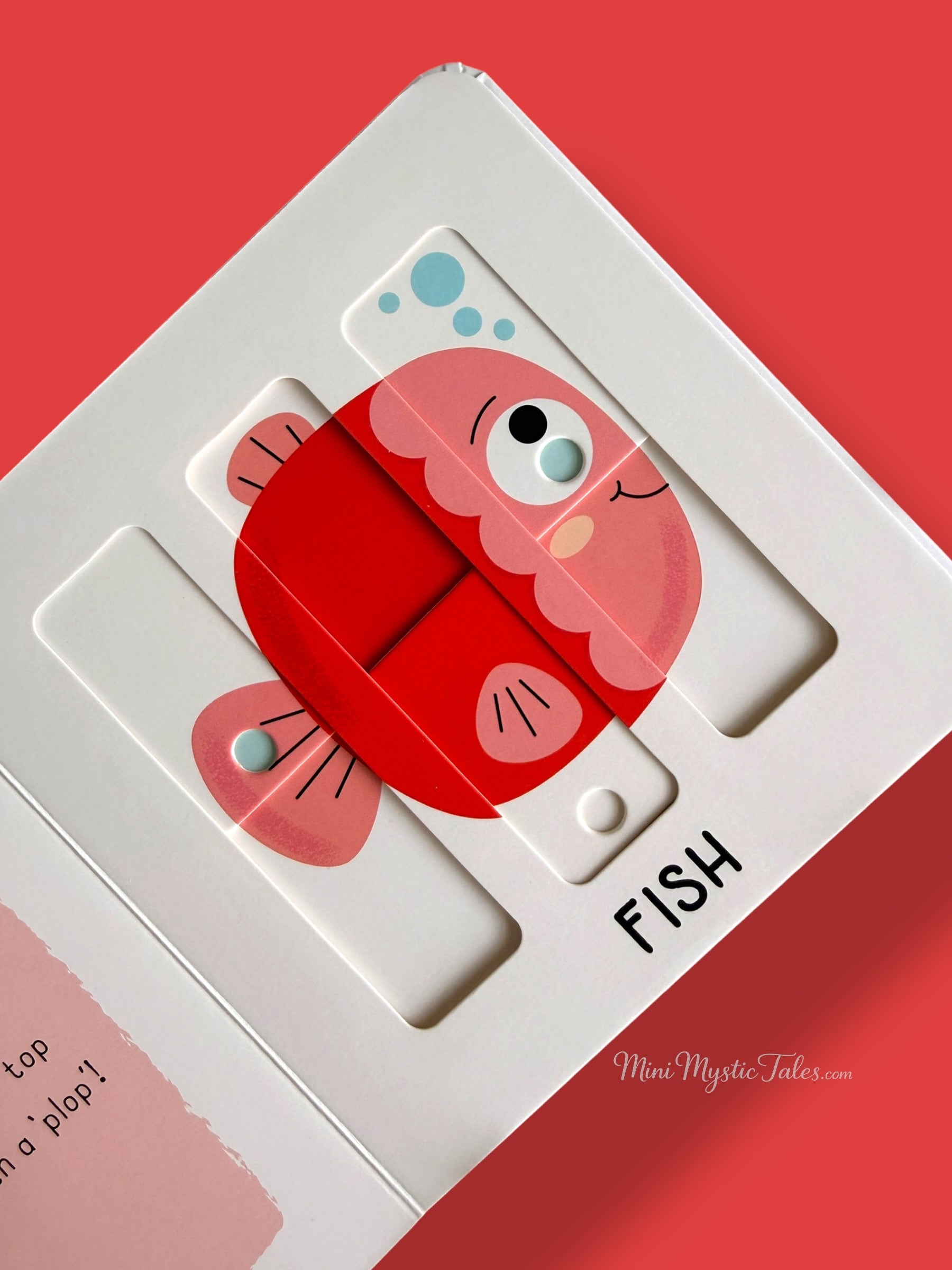 Completed fish puzzle in a hands-on interactive pets board book for young children