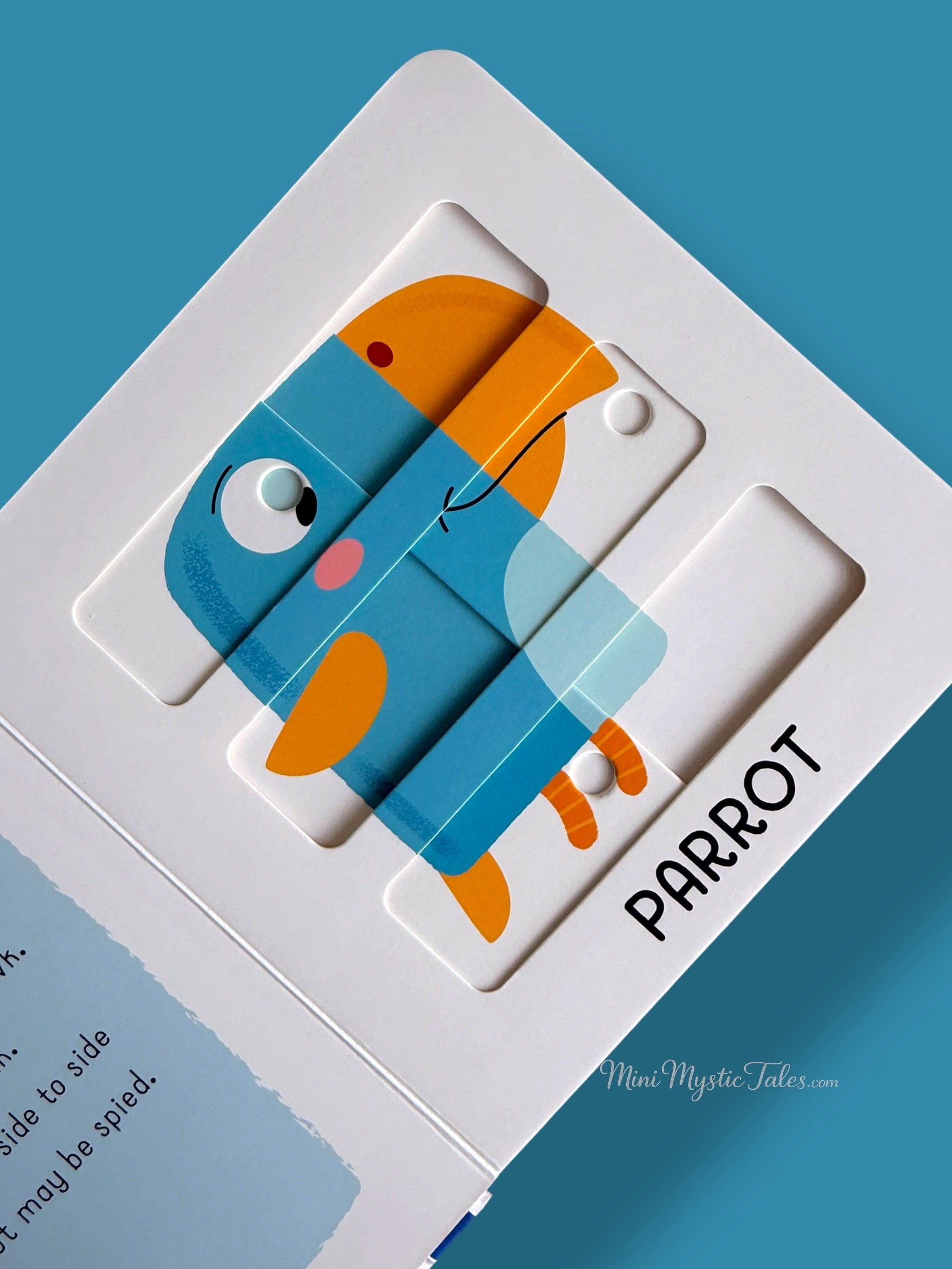Completed parrot puzzle showing the finished pet bird image in an interactive puzzle book