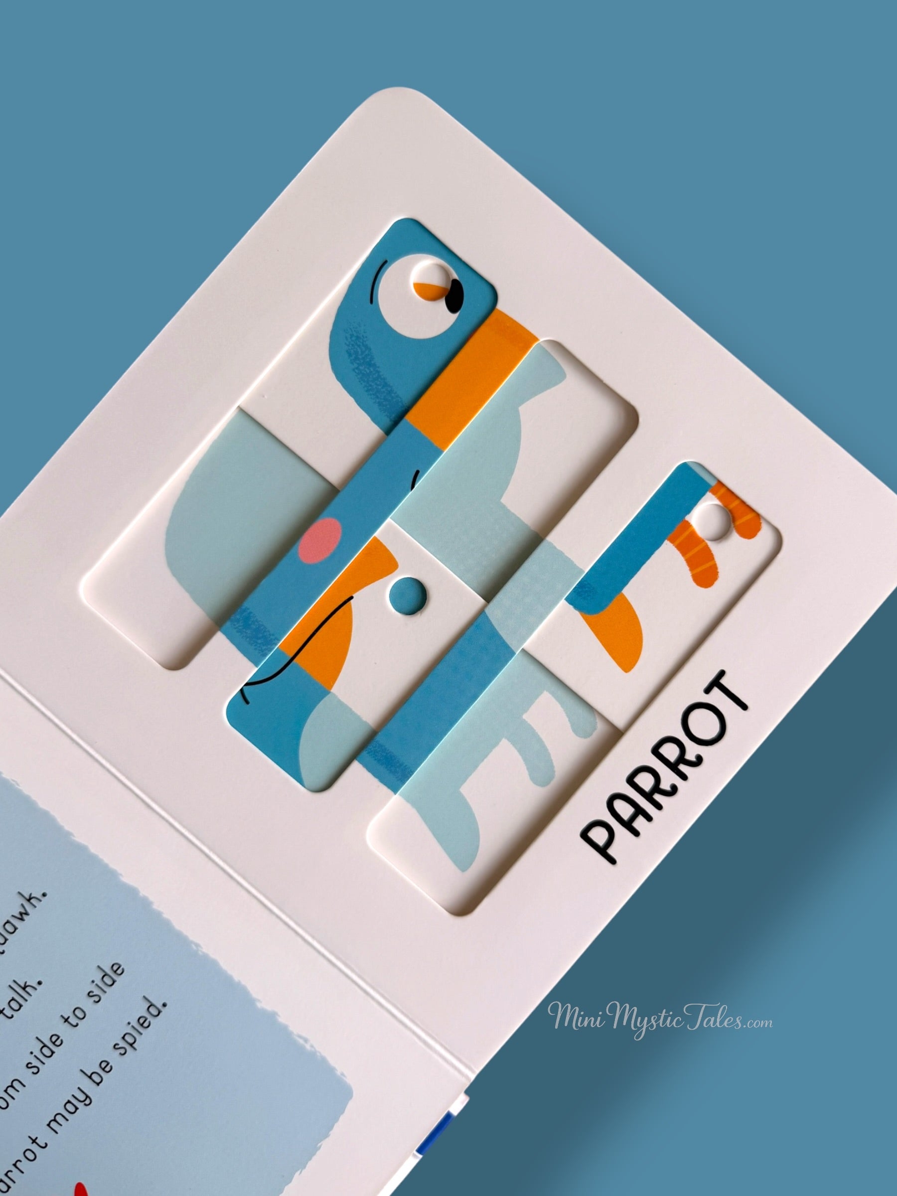 Colourful parrot sliding puzzle activity page in a toddler learning board book