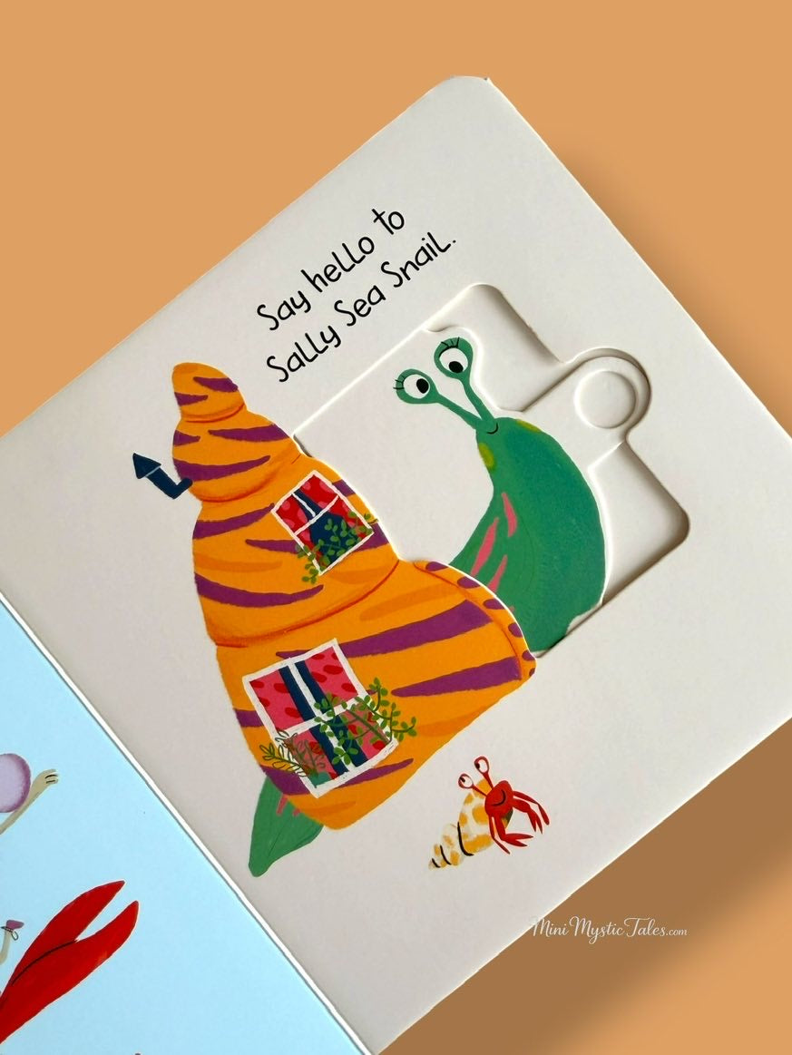 Slide and Peek In The Ocean movable board book showing a colourful sea snail reveal for toddlers.
