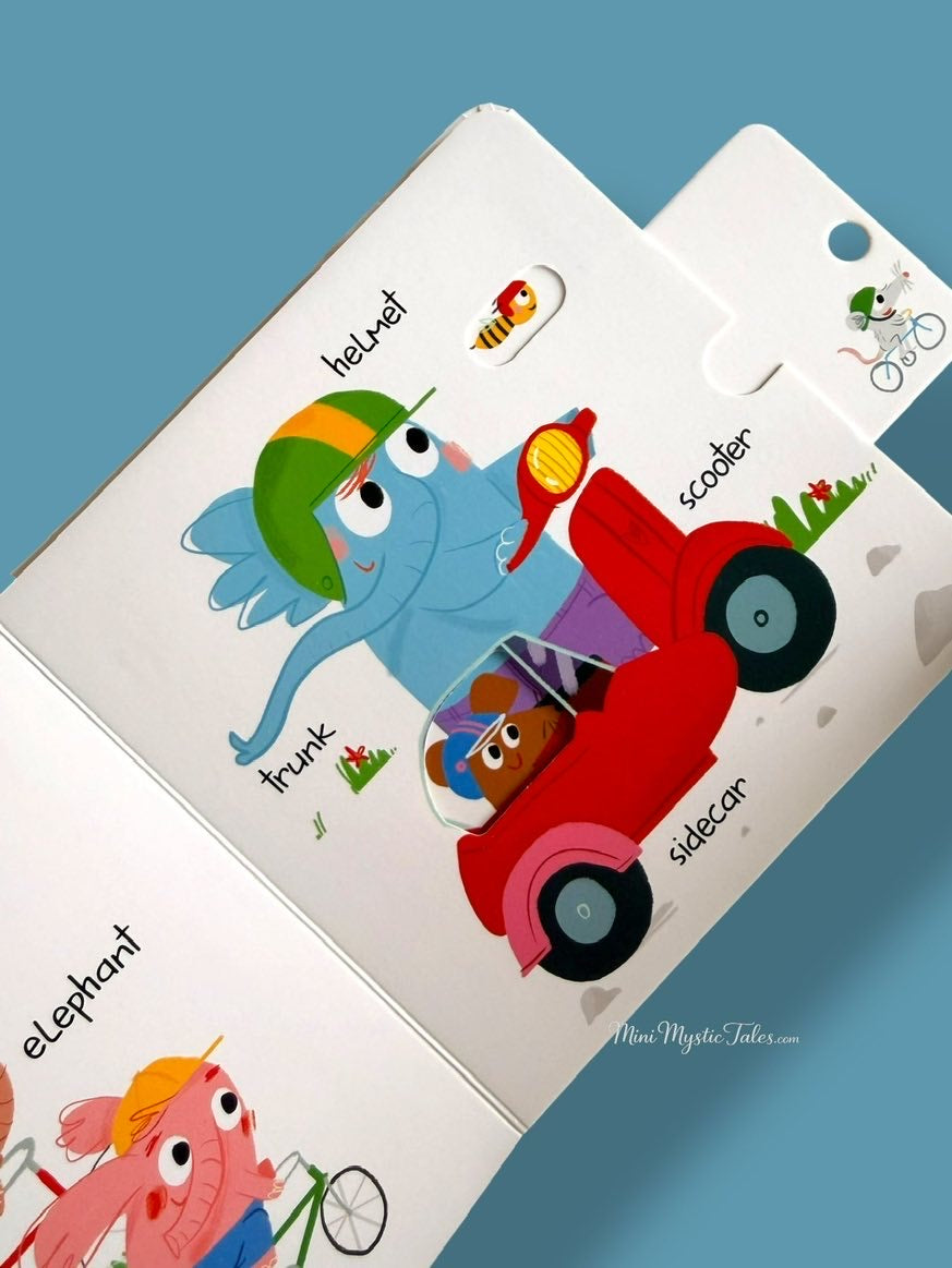 Interactive vehicle board book for toddlers with an elephant on a scooter and fun slide-and-peek surprises.