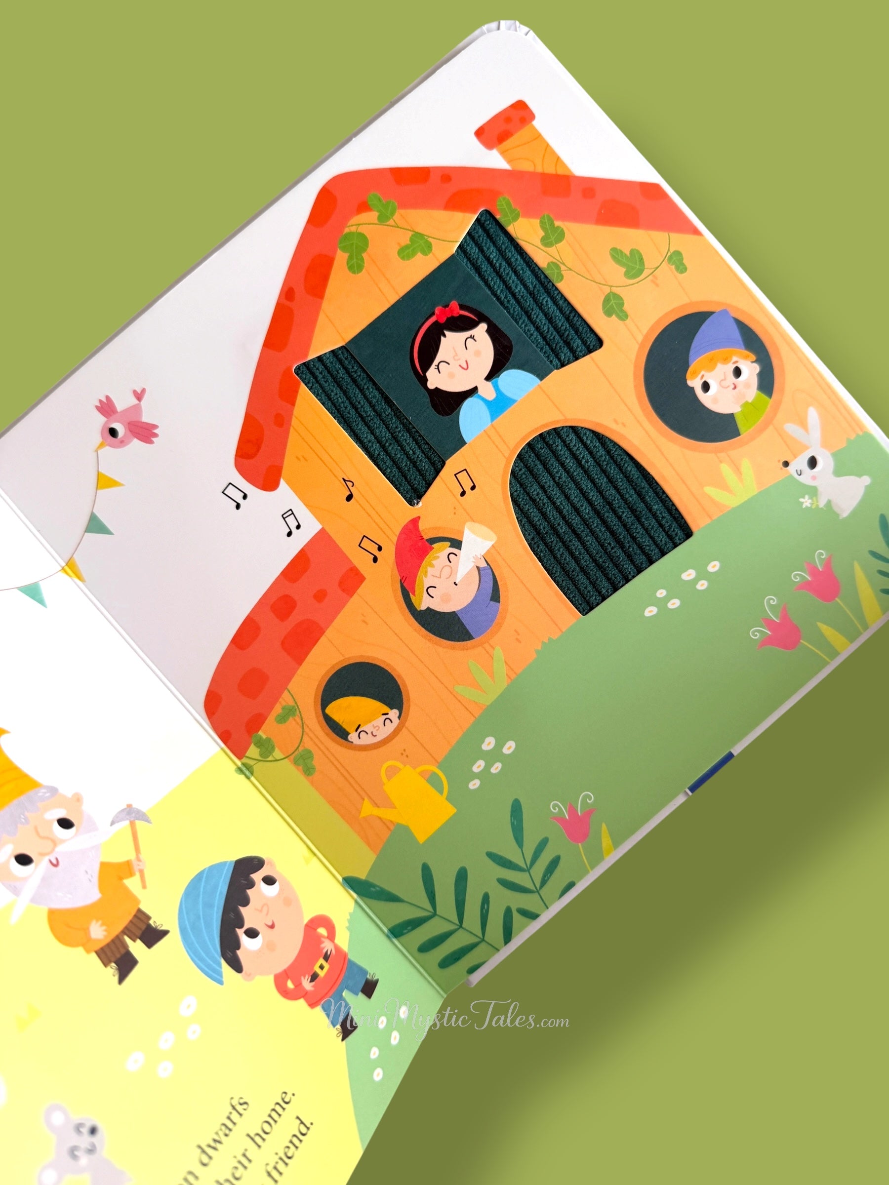 Snow White touch and feel story page showing the seven dwarfs house