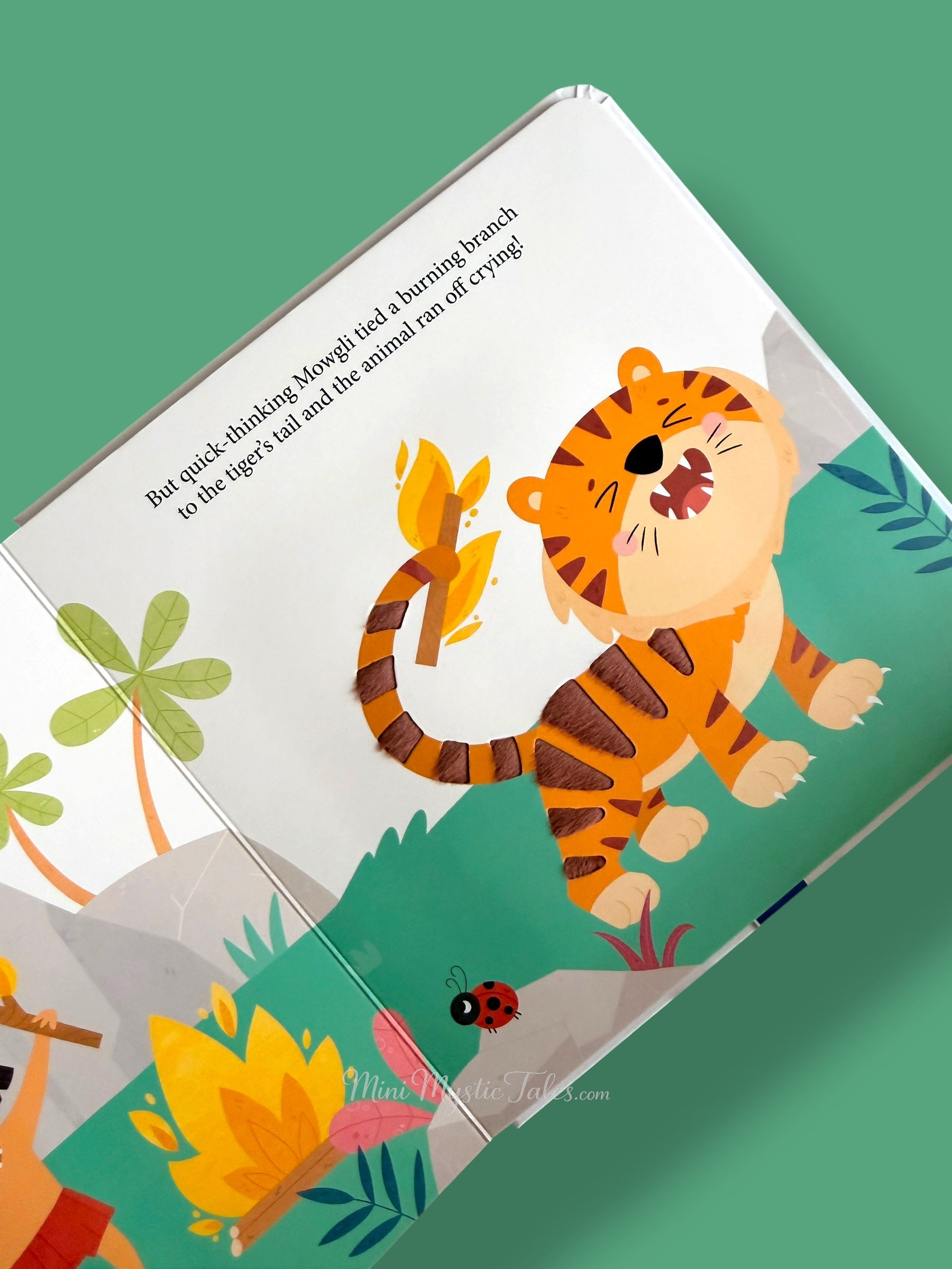 Jungle Book touch and feel story page showing tiger with textured tail in jungle scene