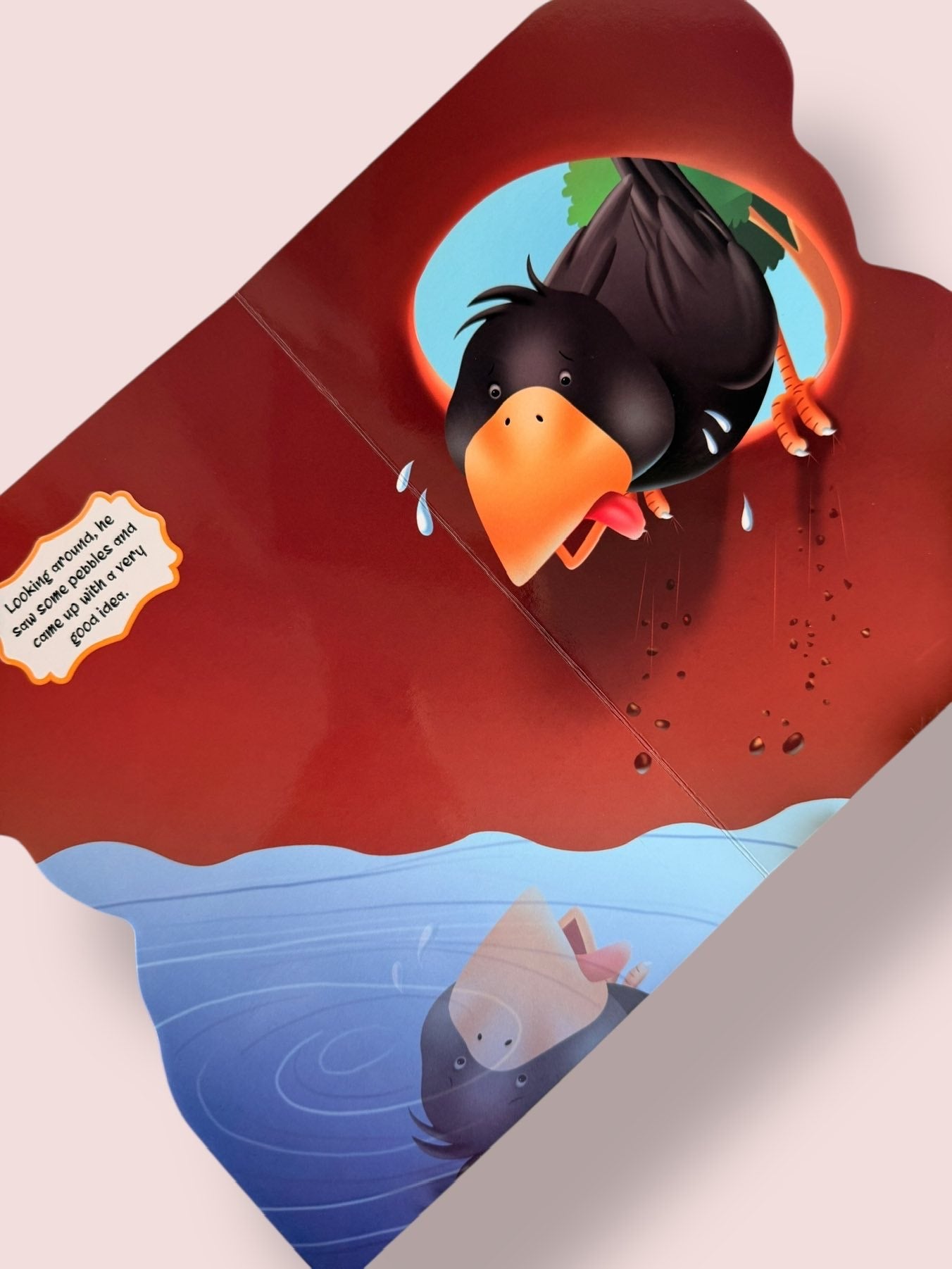Colourful story pages of The Thirsty Crow Story Board Book featuring the clever crow finding a pot with little water and thinking of a solution