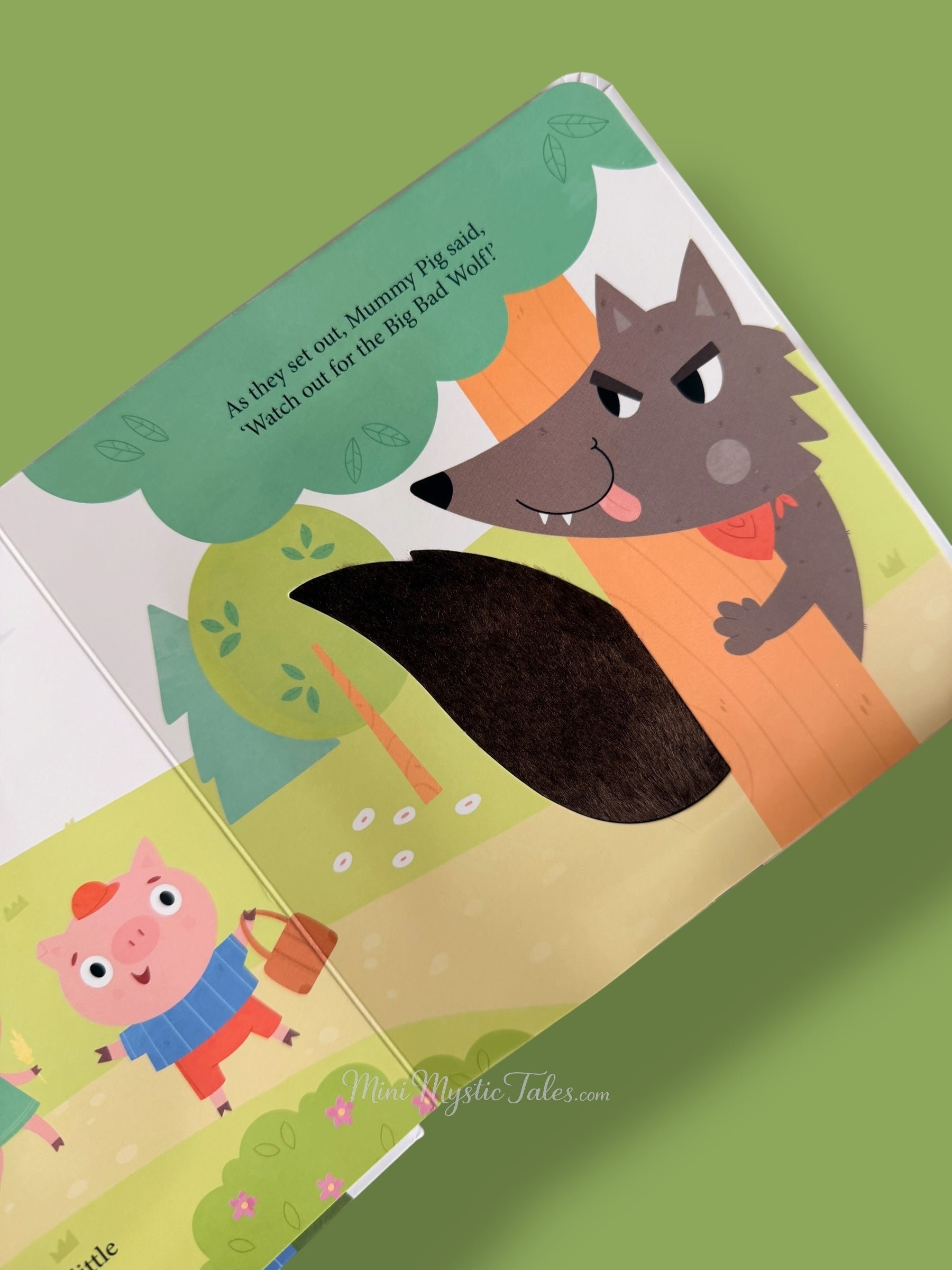 Three Little Pigs touch and feel story page showing the Big Bad Wolf with textured tail