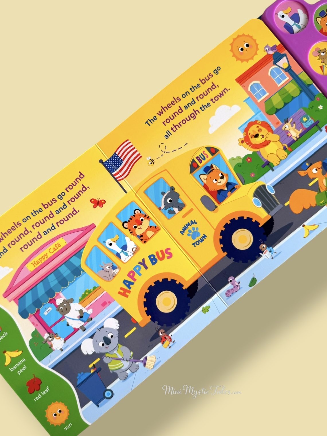 Inside pages of The Wheels on the Bus sound book featuring the classic nursery rhyme with colorful illustrations, search-and-find activities, and interactive audio.