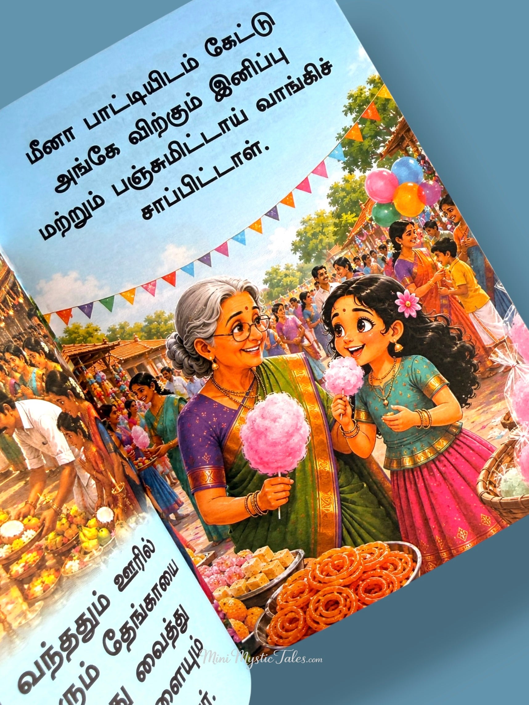Little girl and grandmother enjoying cotton candy and festival treats at a Tamil village fair
