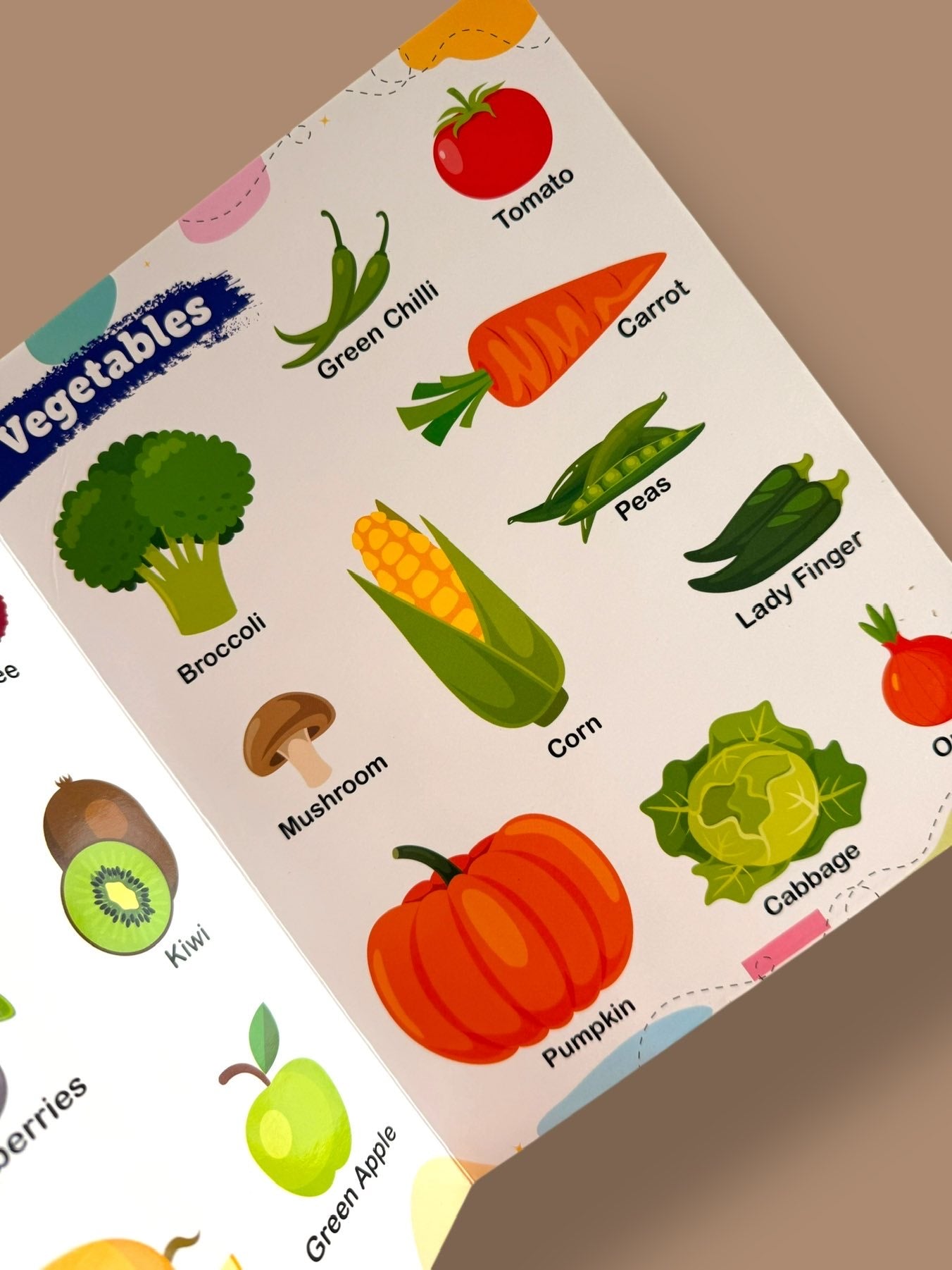 Vegetables learning page introducing broccoli, tomato, carrot, green chilli, corn, peas, pumpkin, cabbage, mushroom, and lady finger with colourful illustrations