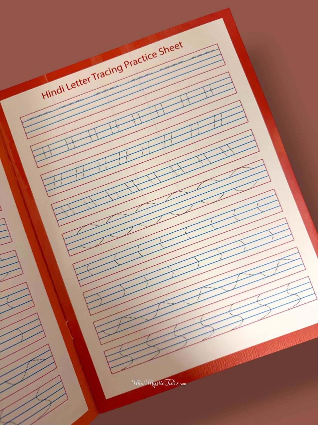 Reusable Hindi letter tracing practice sheet with pre-writing strokes, curves and line patterns for handwriting development